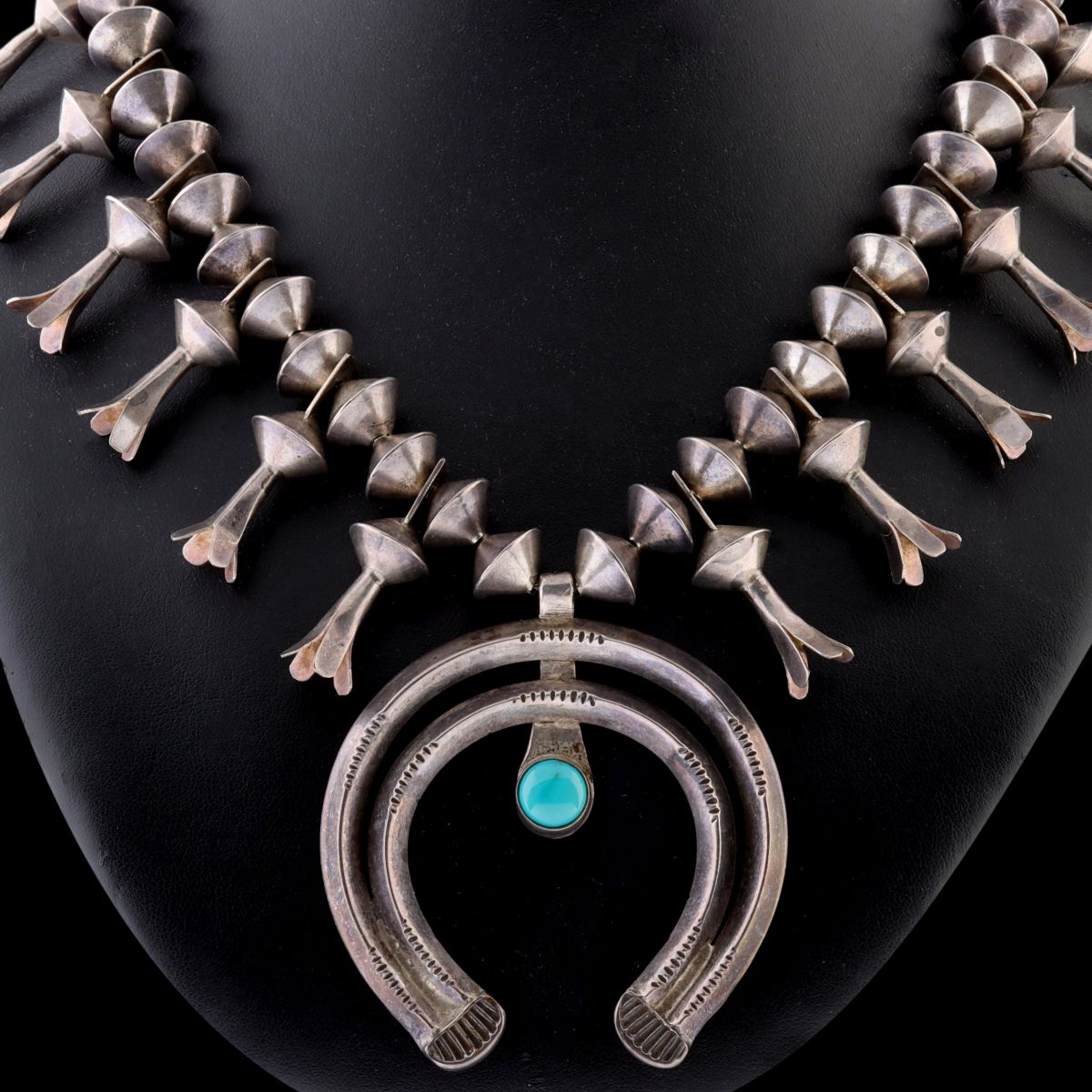 A NAVAJO STERLING SILVER SQUASH BLOSSOM NECKLACE