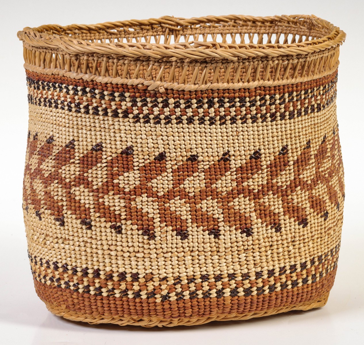 A FOUR COLOR HUPA-KAROK BASKET WITH OPENWORK RIM