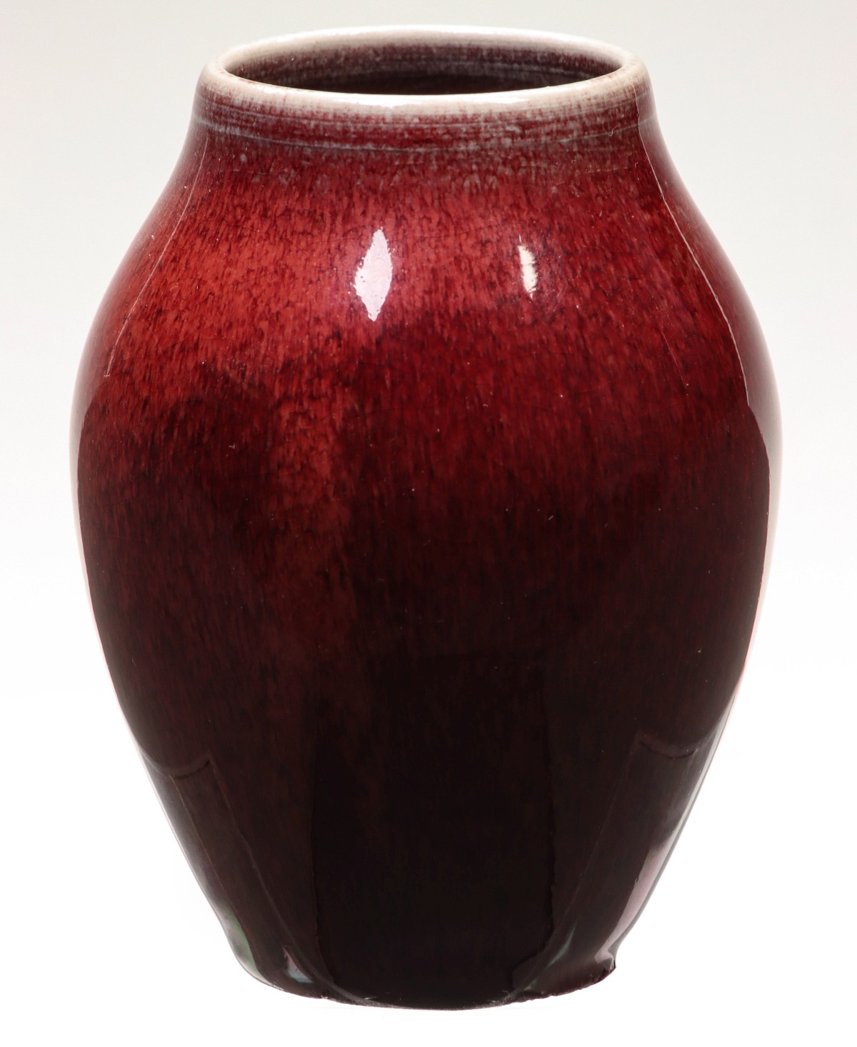 A SMALL ROOKWOOD PORCELAIN CABINET VASE IN OXBLOOD