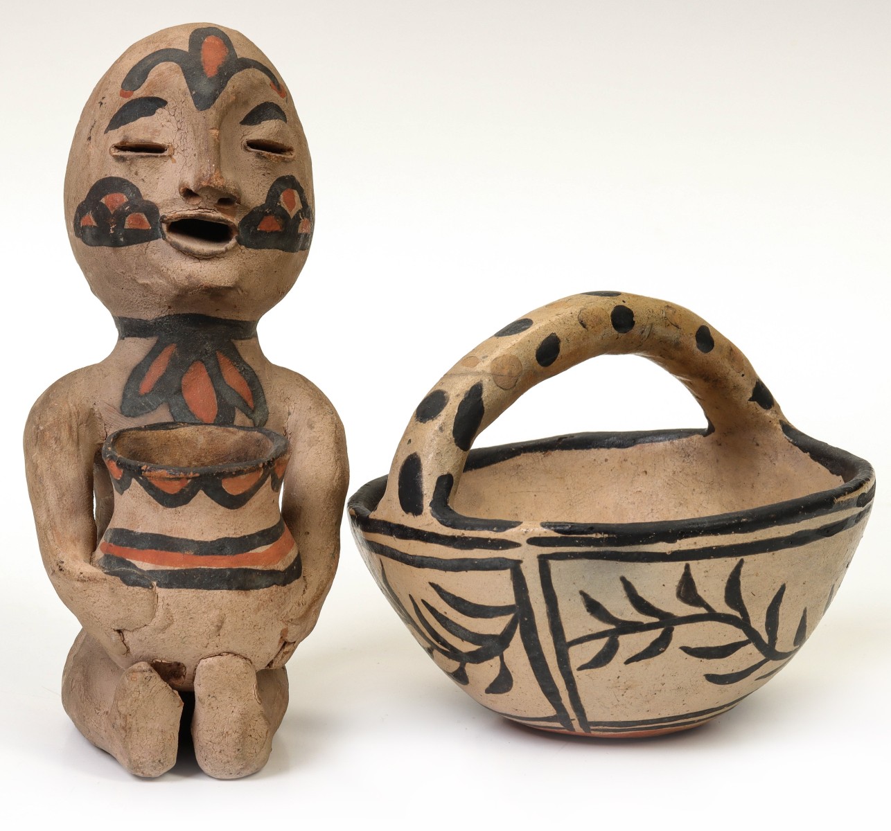 A TESUQUE RAIN GOD FIGURE WITH COCHITI BASKET