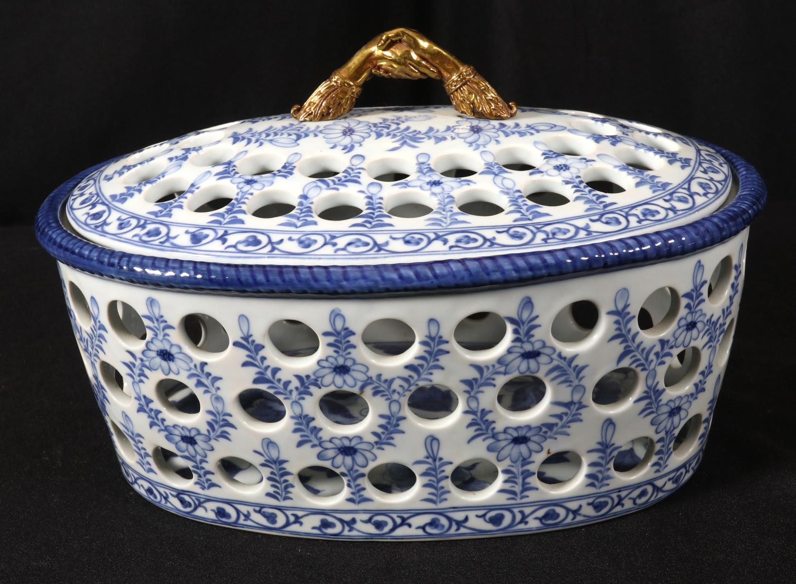 A PIERCED PORCELAIN COVERED DISH SIGNED MAITLAND SMITH