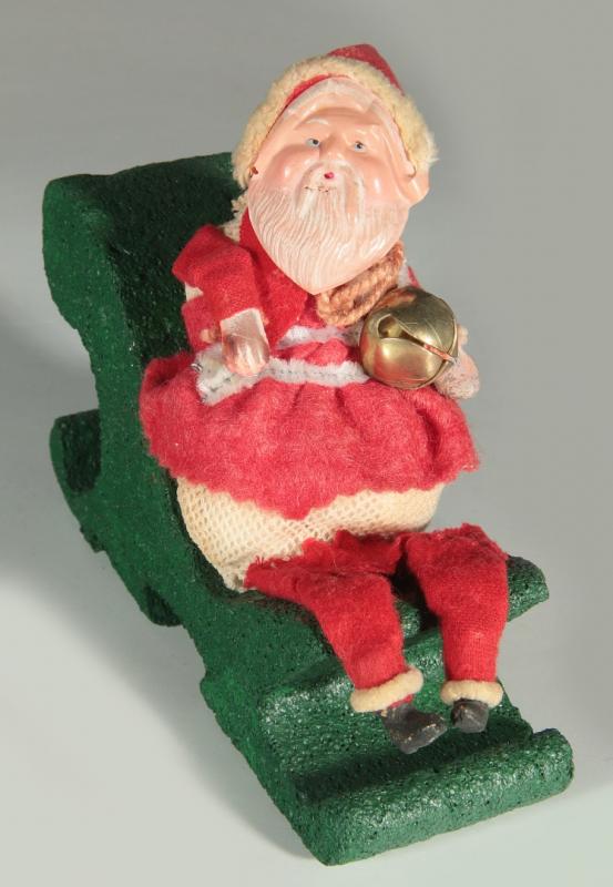 A CEULLOID FACE MESH BODY SANTA CANDY CONTAINER