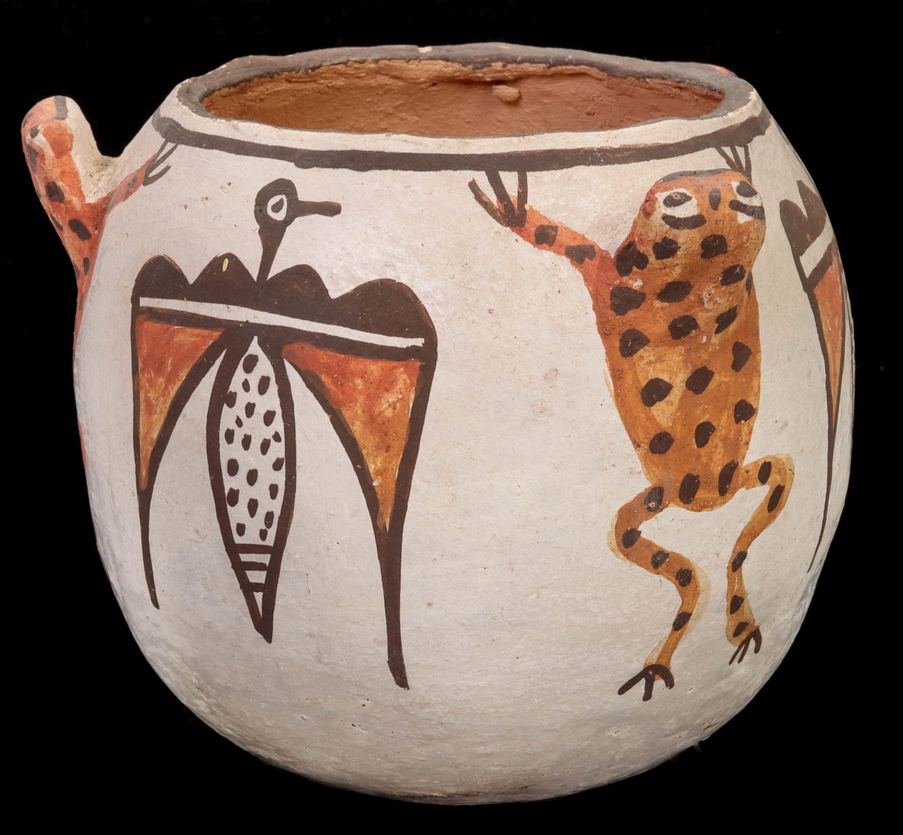 A ZUNI POTTERY JAR WITH THREE-DIMENSIONAL FROG EFFIGIES