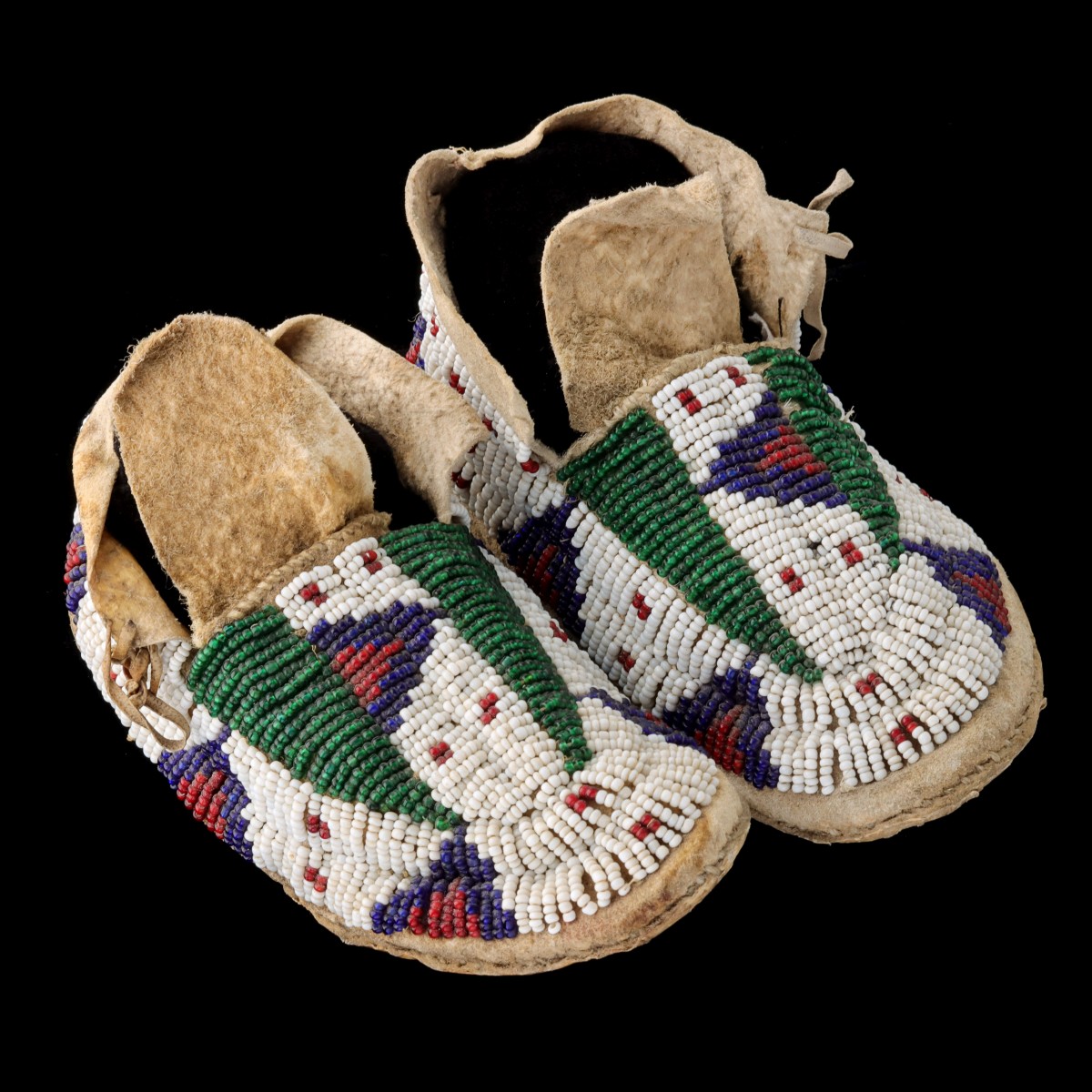 A PAIR SIOUX SINEW-SEWN BEADED MOCCASINS CIRCA 1910