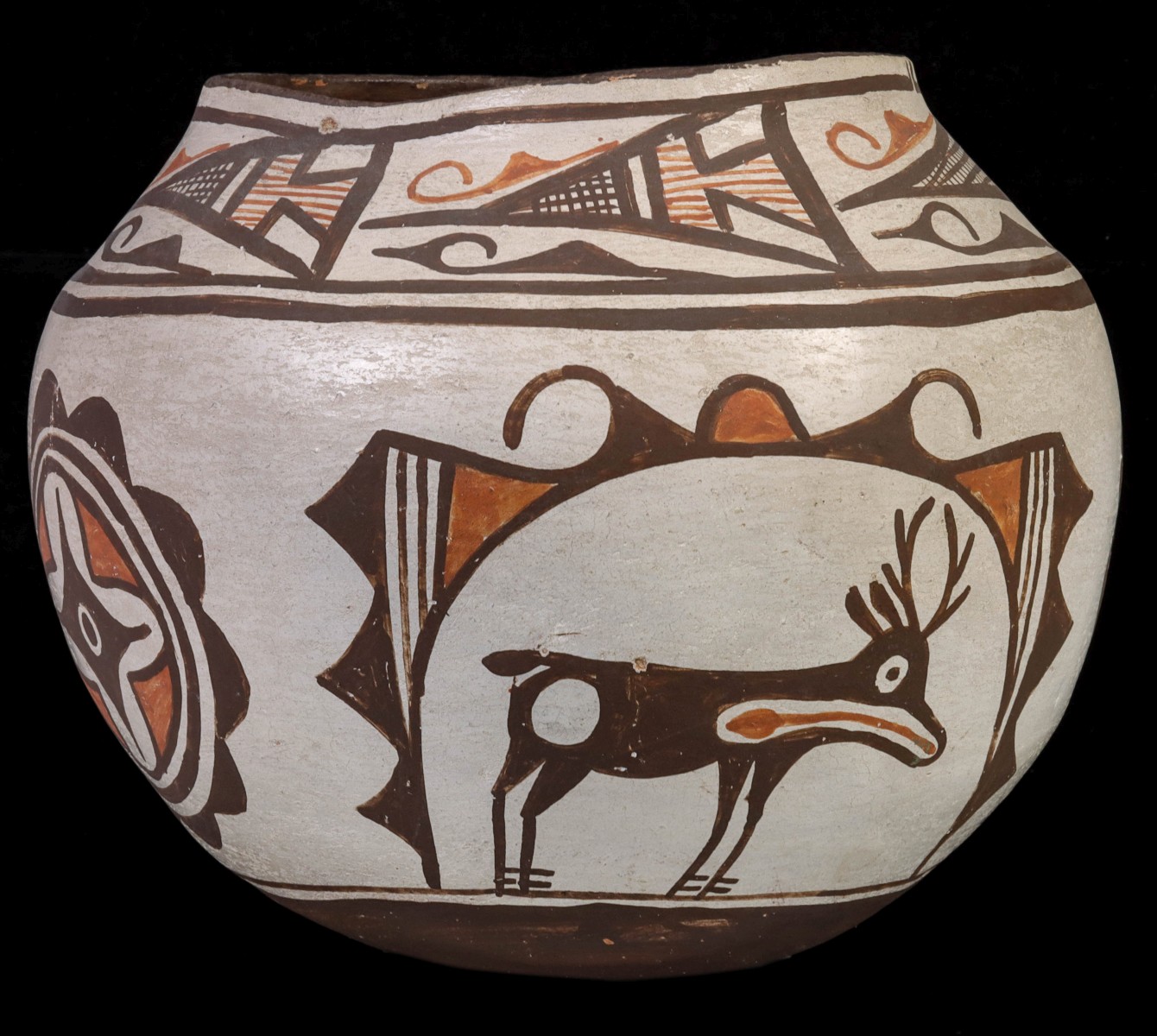 A ZUNI POTTERY OLLA WITH HEARTLINE DEER CIRCA 1920