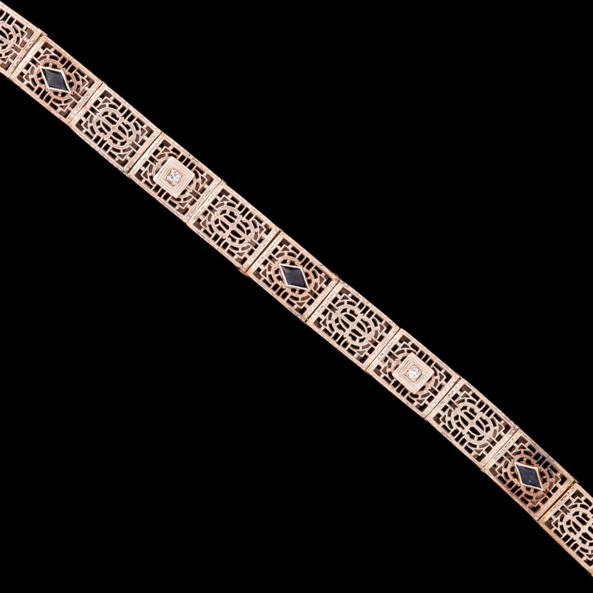 AN ANTIQUE 10K GOLD BRACELET WITH DIAMOND AND SAPPHIRES