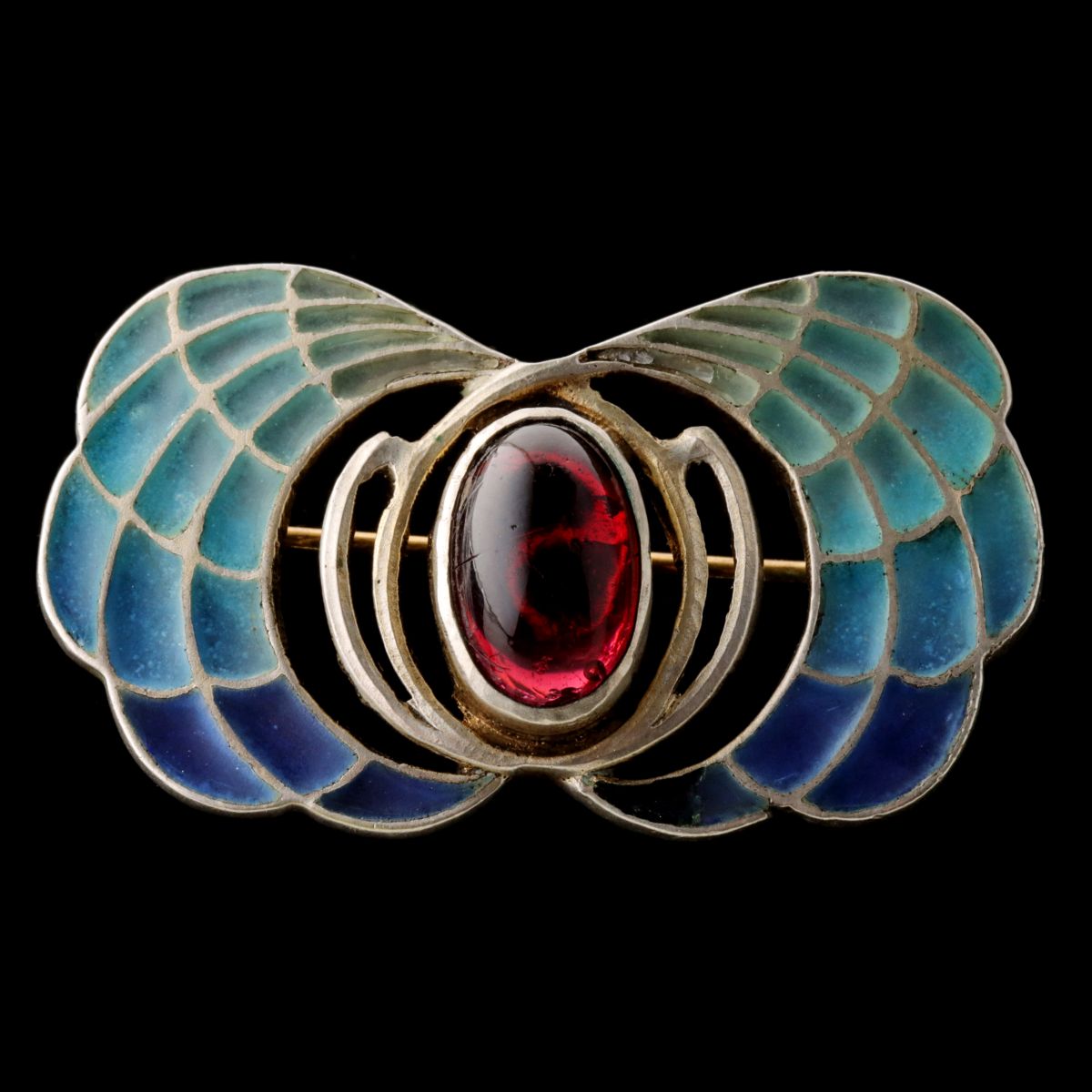 A CIRCA 1900 PLIQUE A JOUR BROOCH WITH CABOCHON