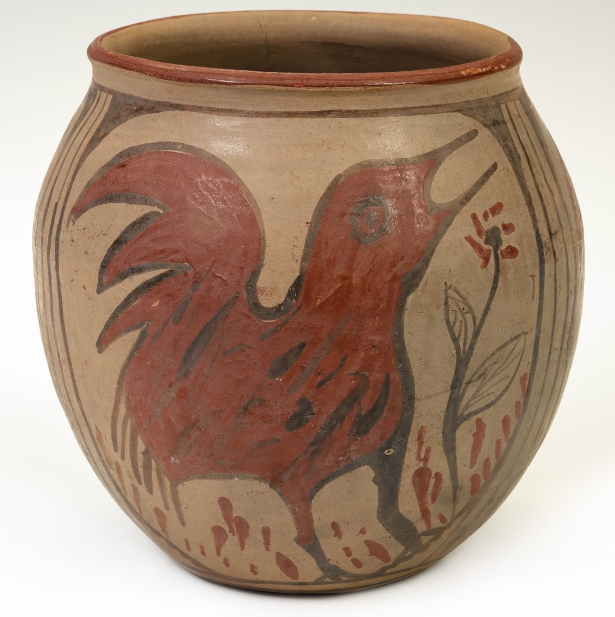 A PUEBLO POTTERY JAR WITH BIRD