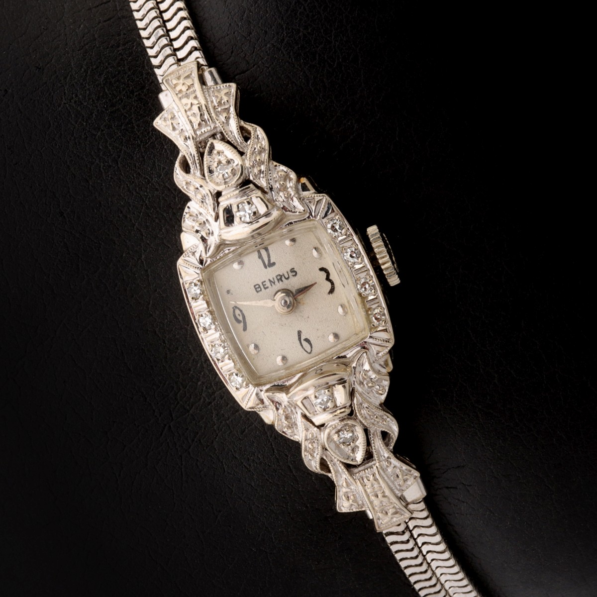 A BENRUS LADY'S VINTAGE 14K GOLD AND DIAMOND WATCH