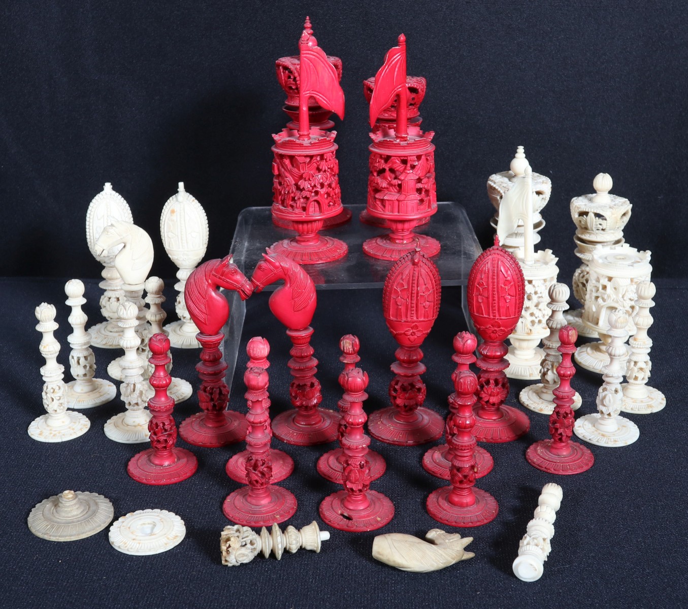 AN INCOMPLETE CARVED CHESS SET IN AS FOUND CONDITION