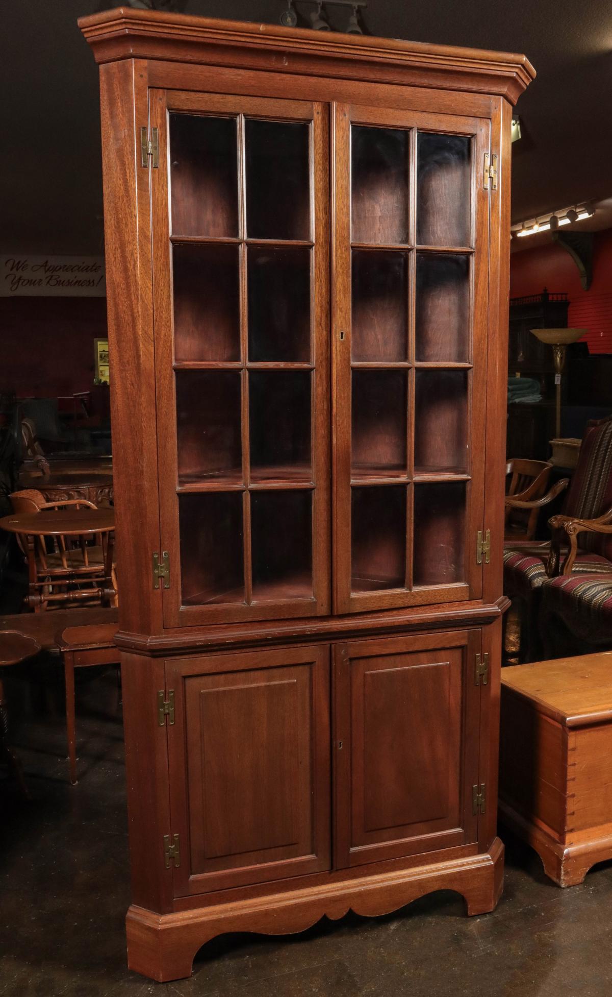 A GOOD SOLID MAHOGANY CORNER CABINET