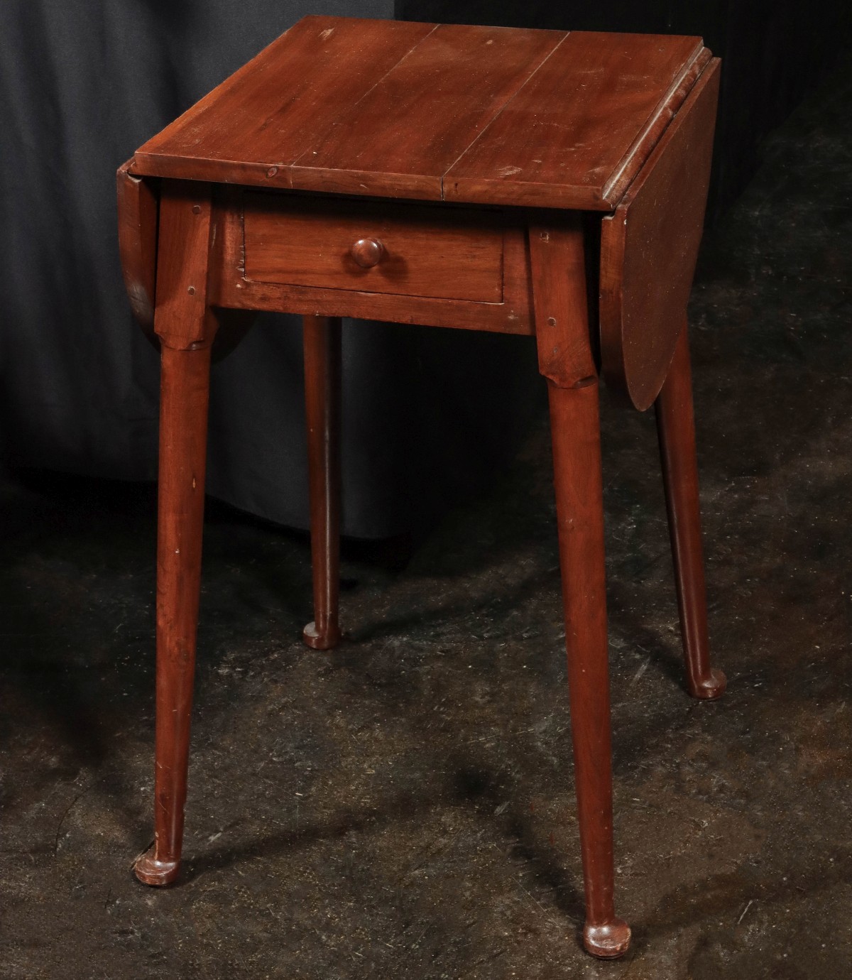 A DROP LEAF ONE DRAWER STAND TABLE