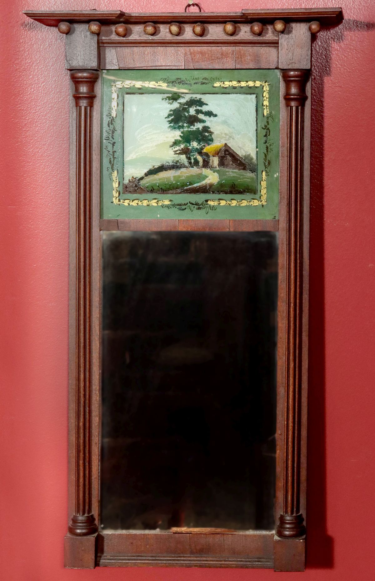 AN 1840s MAHOGANY MIRROR WITH REVERSE PAINTED TABLET