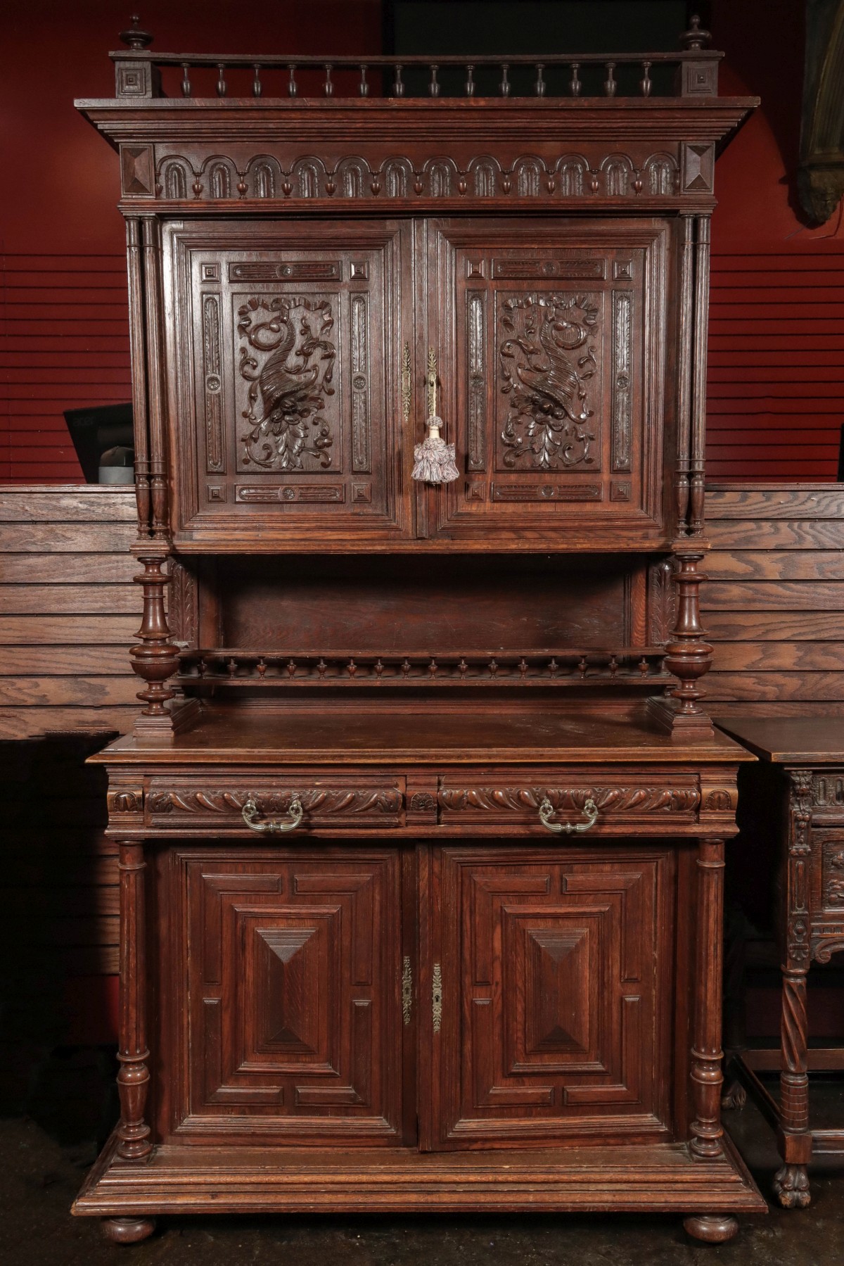 A 19TH CENTURY CONTINENTAL CARVED OAK CABINET