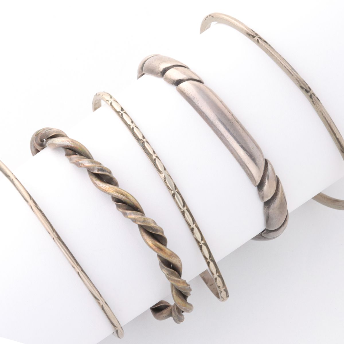 FIVE VARIOUS STERLING SILVER CUFF BRACELETS