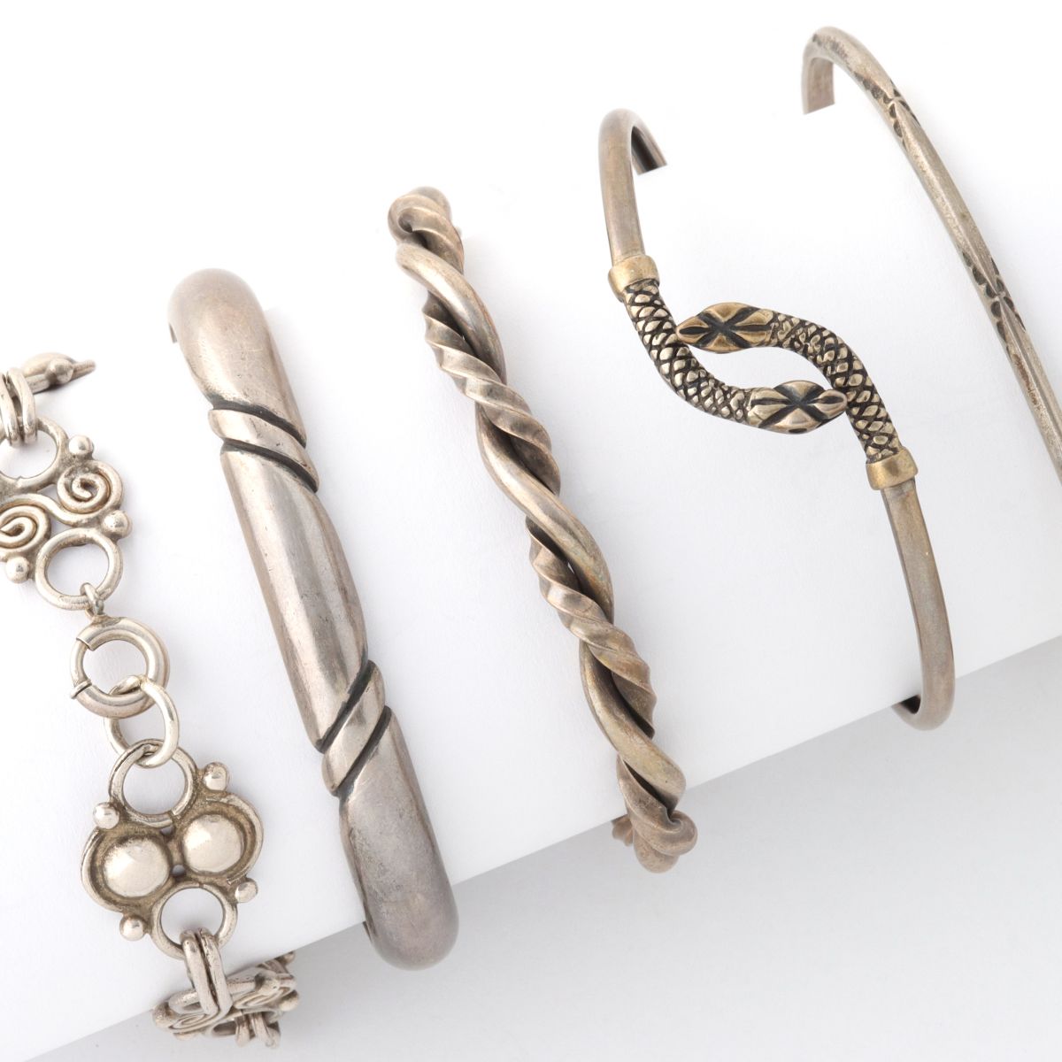 FIVE STERLING SILVER CUFF, LINK AND OTHER BRACELETS