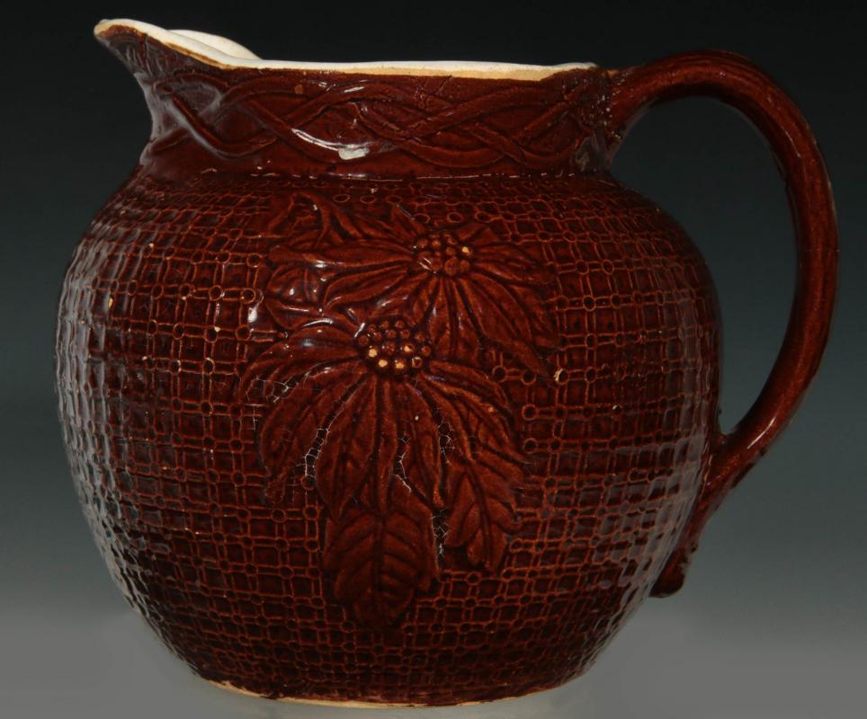 POINSETTA ON BURLAP BROWN GLAZE STONEWARE PITCHER