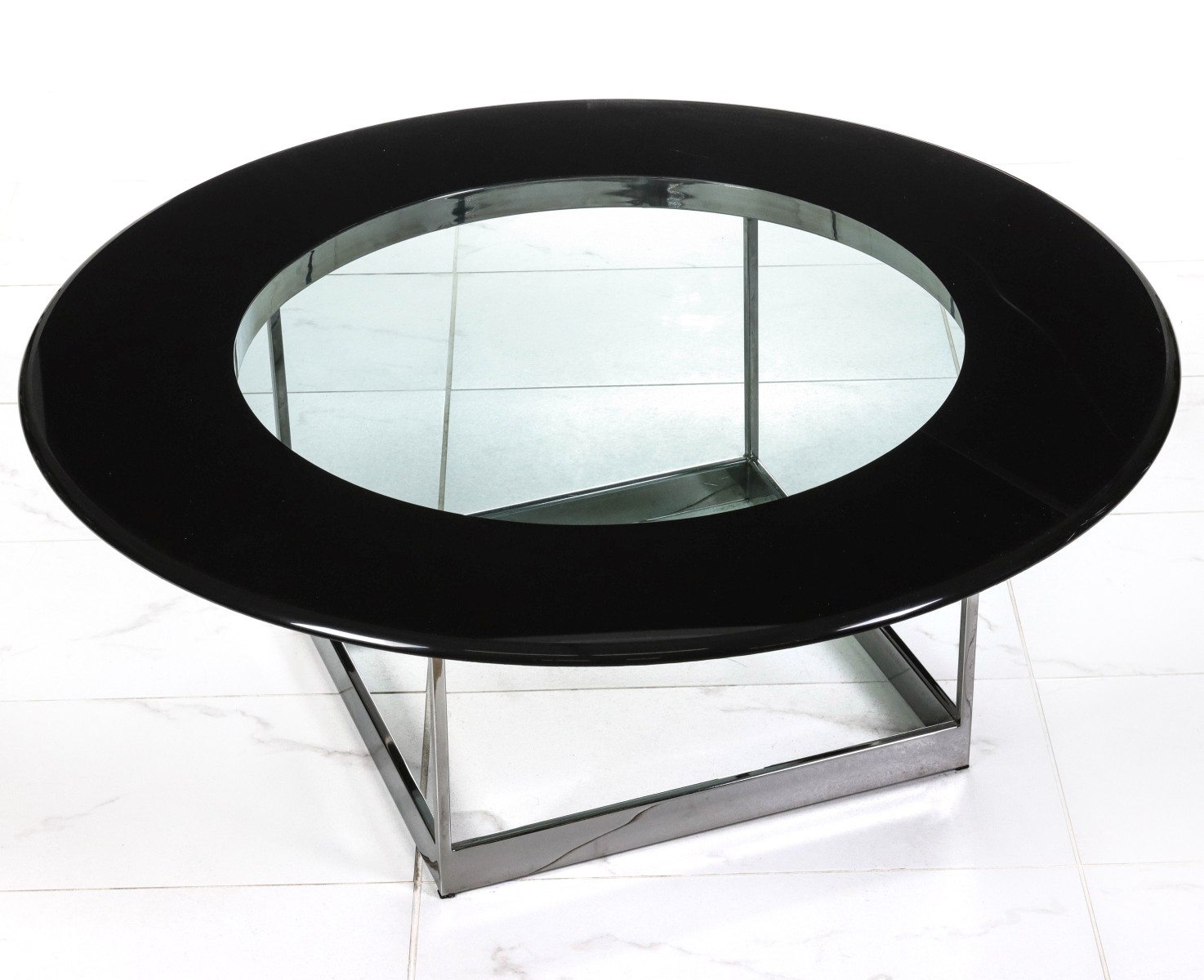 A CONTEMPORARY PLATE GLASS AND CHROME OCCASIONAL TABLE