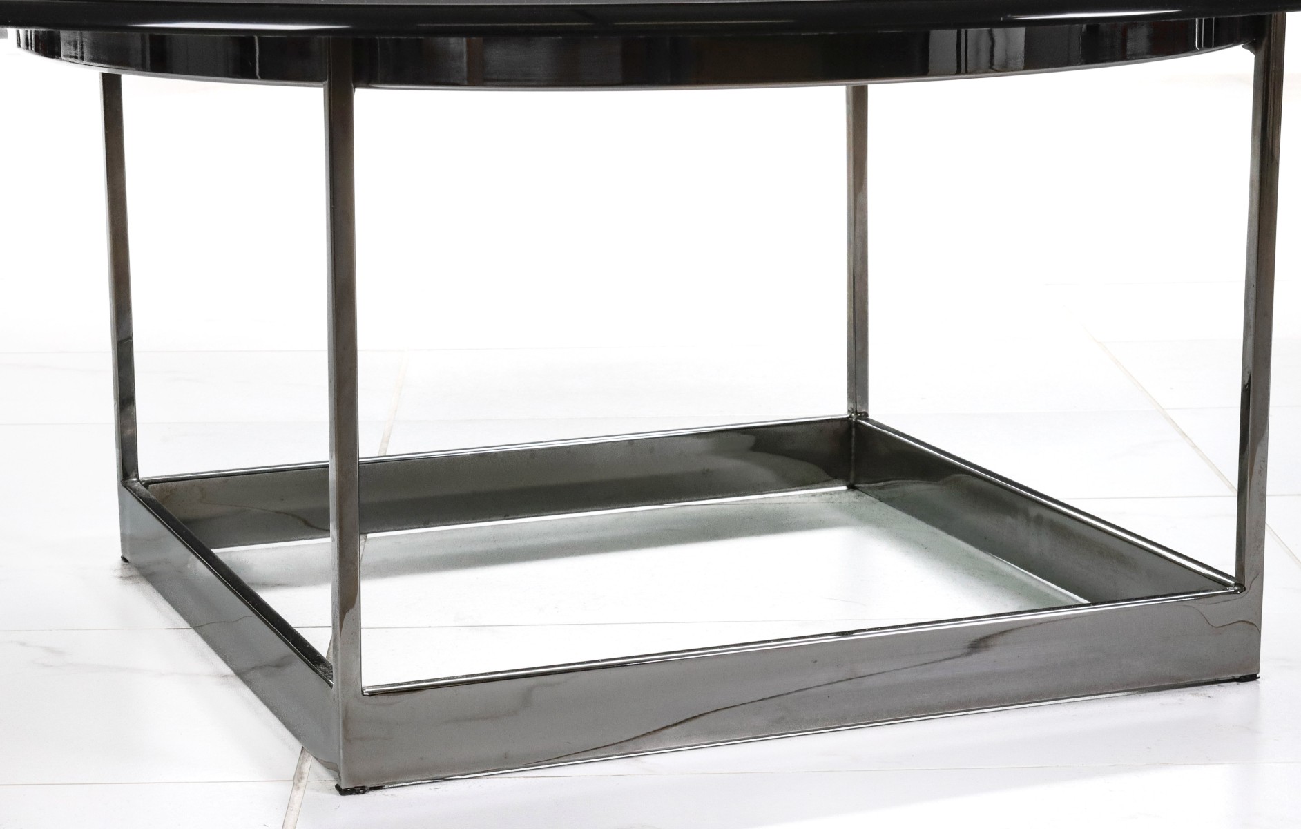 A CONTEMPORARY PLATE GLASS AND CHROME OCCASIONAL TABLE