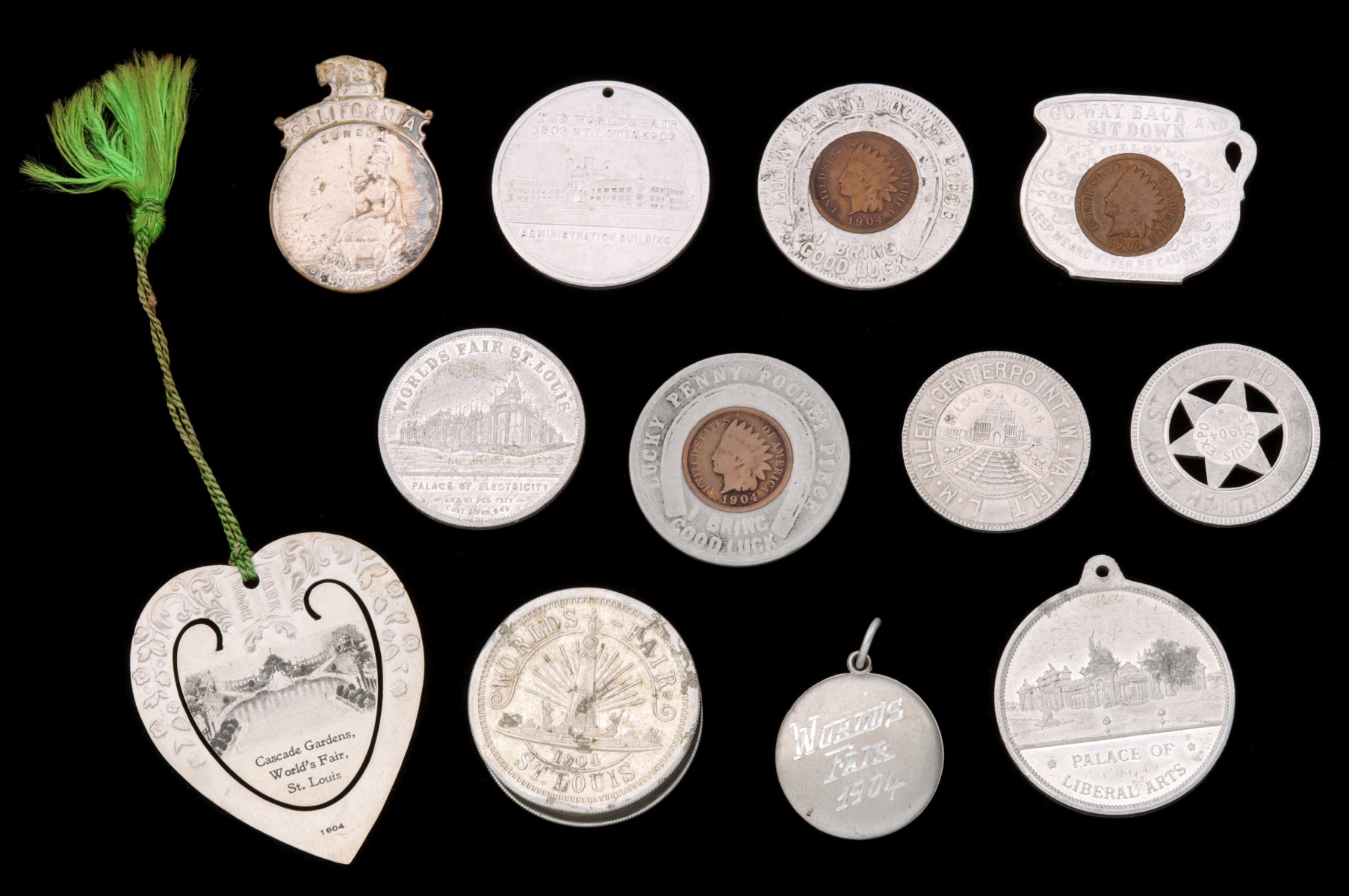 ALUMINUM SOUVENIRS AND TOKENS WITH 1904 PENNIES