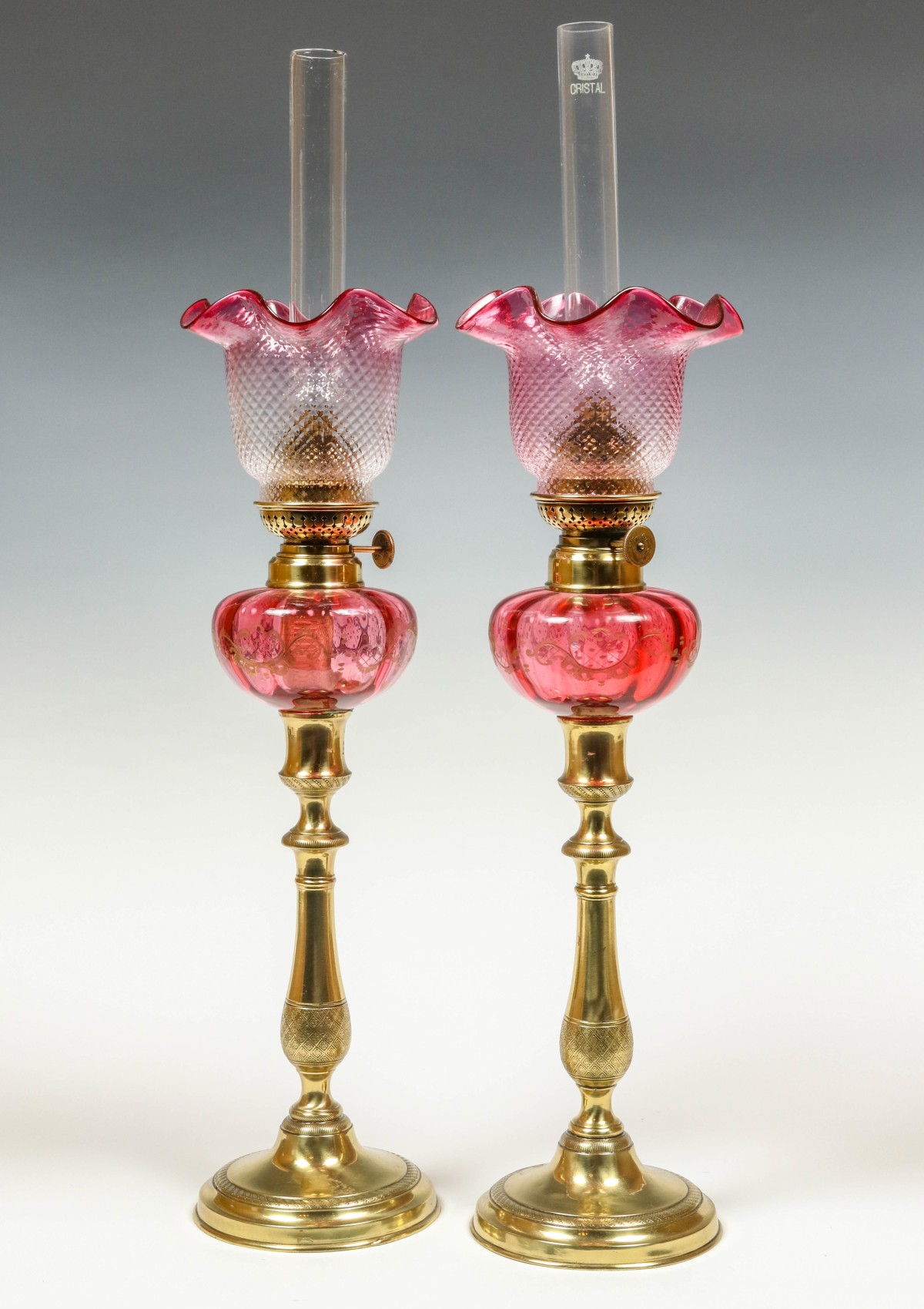 ORNATE BRASS AND CRANBERRY PEG LAMPS, RUBINA SHADES