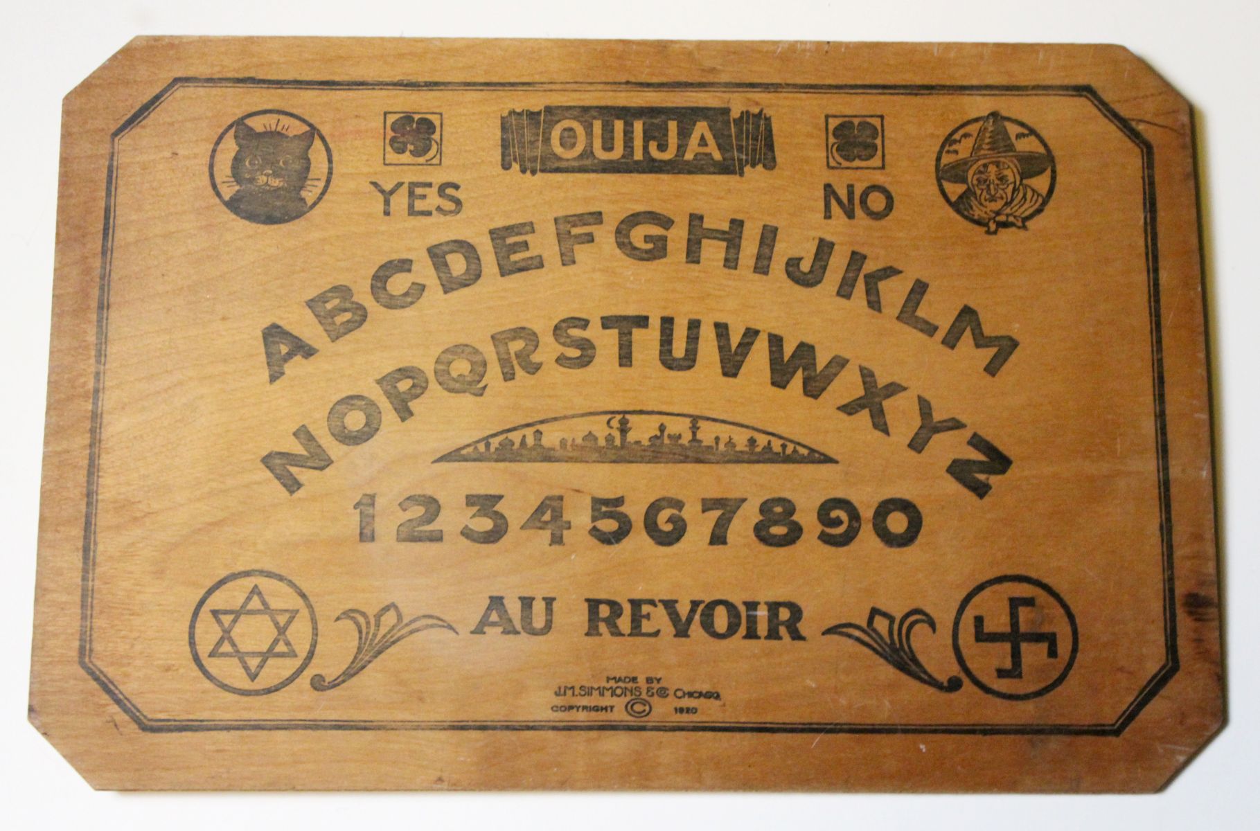 J.M. SIMMONS PRINTED WOOD OUIJA BOARD CIRCA 1920s