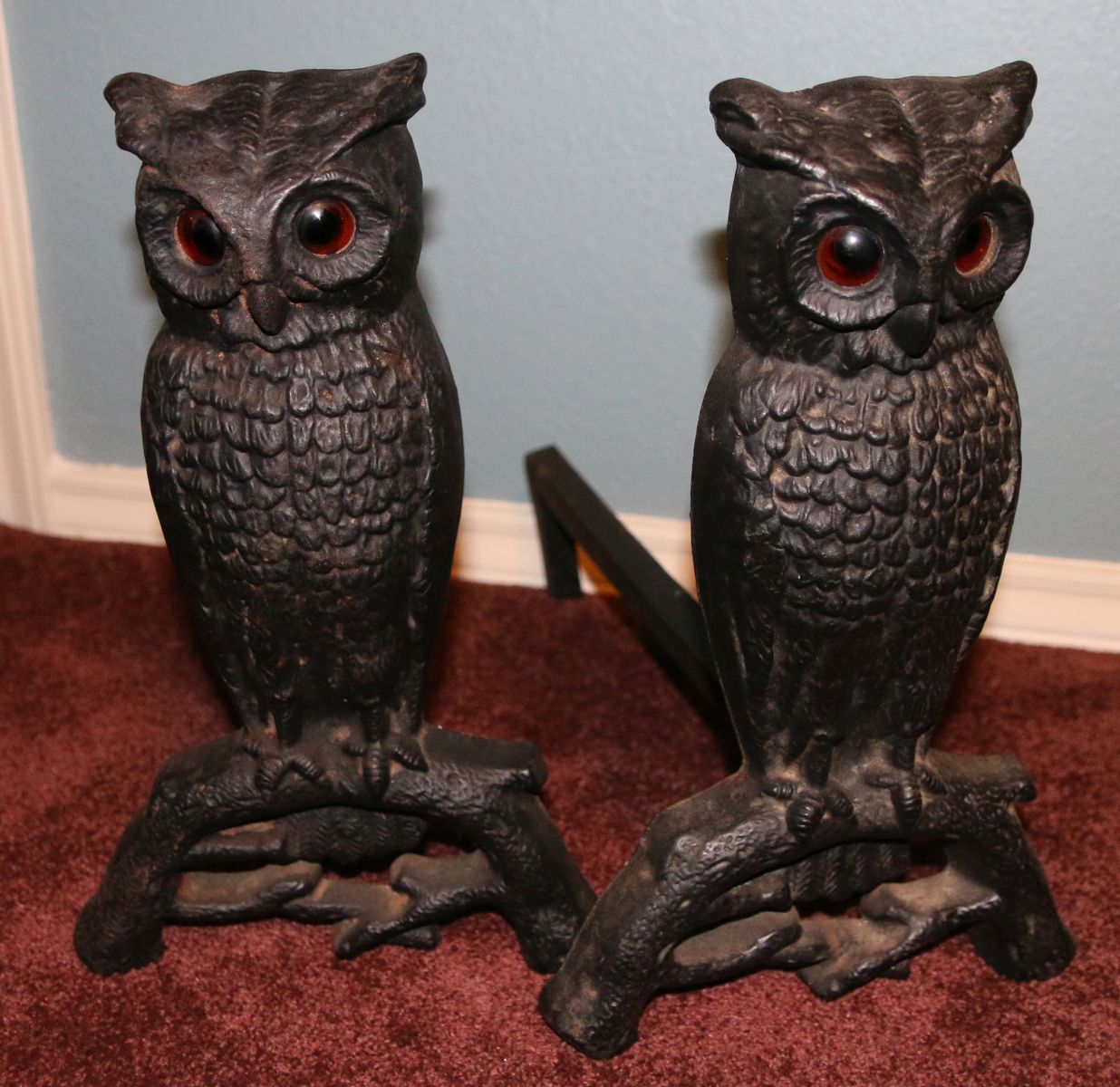 A PAIR ANTIQUE CAST IRON GLASS EYE OWL ANDIRONS