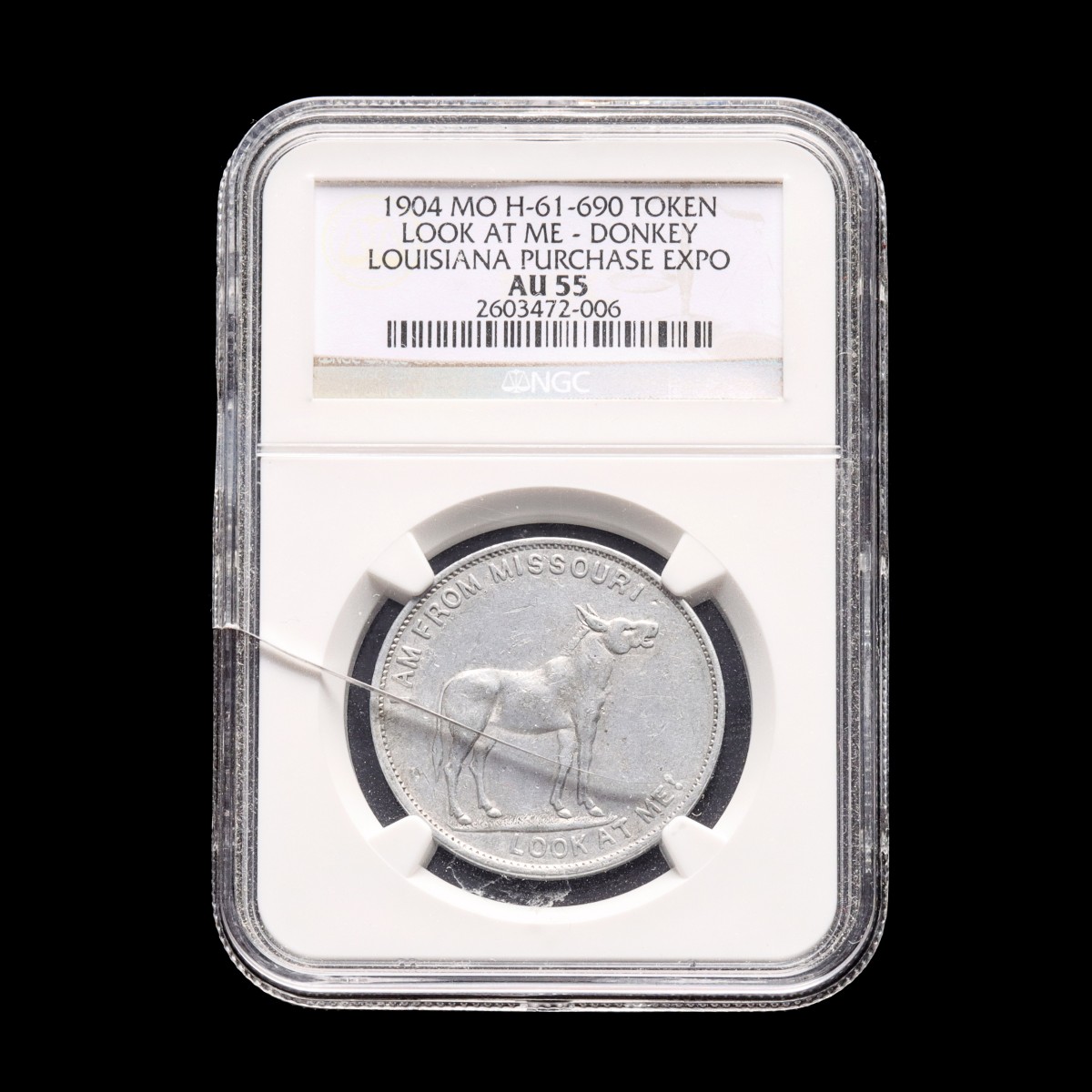 AN NGC GRADED 1904 LOUISIANA PURCHASE EXPO TOKEN