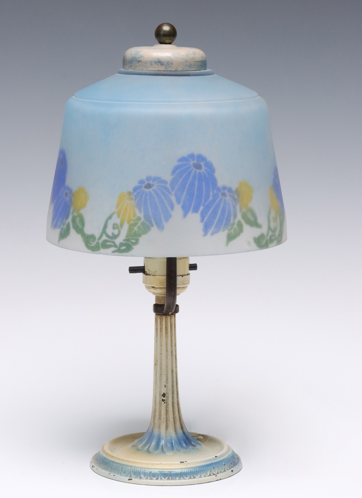 A 1930s REVERSE PAINTED LAMP MANNER OF MOE BRIDGES