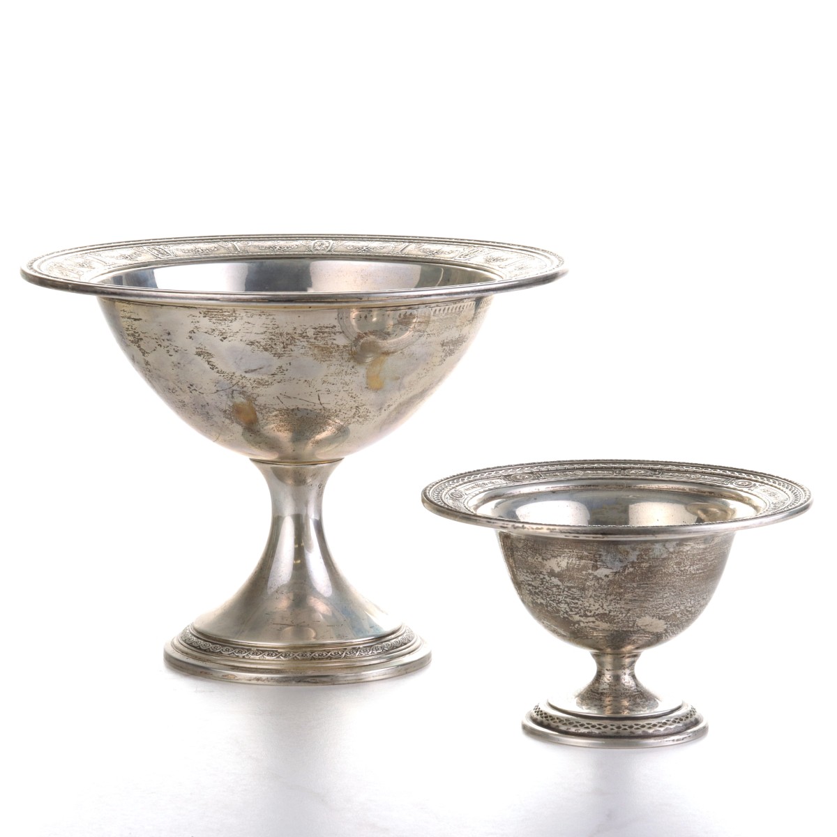 TWO FOOTED STERLING SILVER COMPOTES WITH EMBOSSED RIM