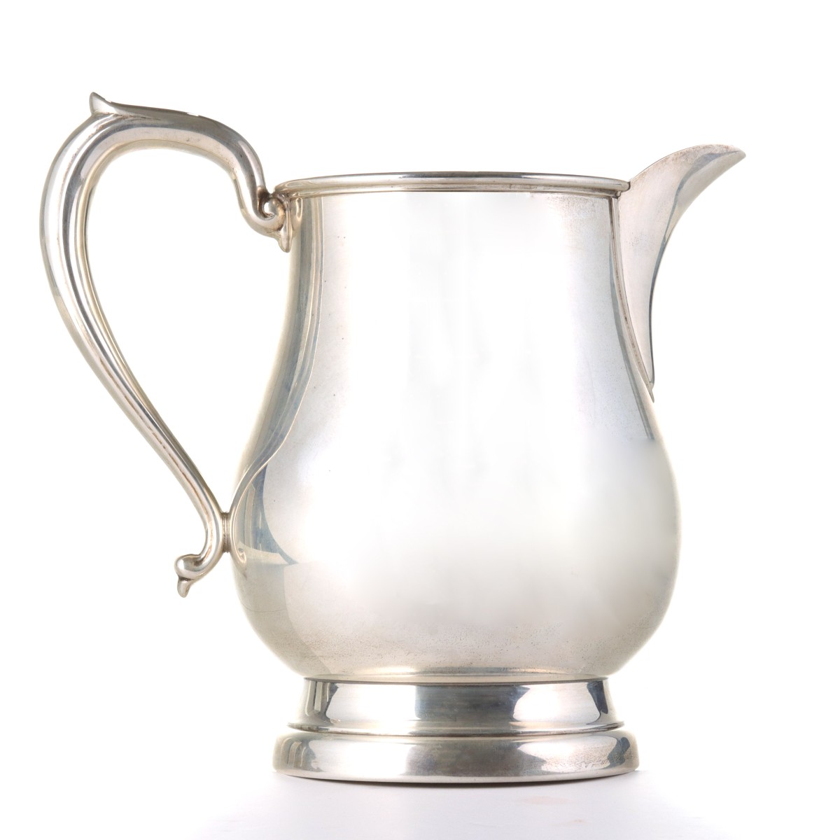 A STERLING SILVER WATER PITCHER SIGNED S. KIRK AND SON