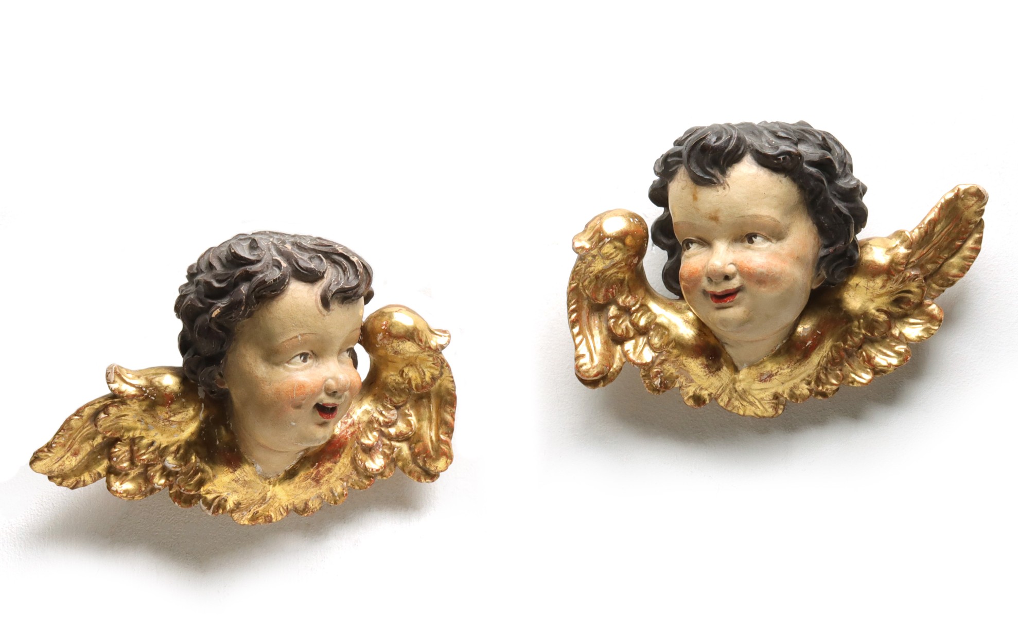 EARLY TO MID 20TH C. CARVED AND GESSOED CHERUB PAIR