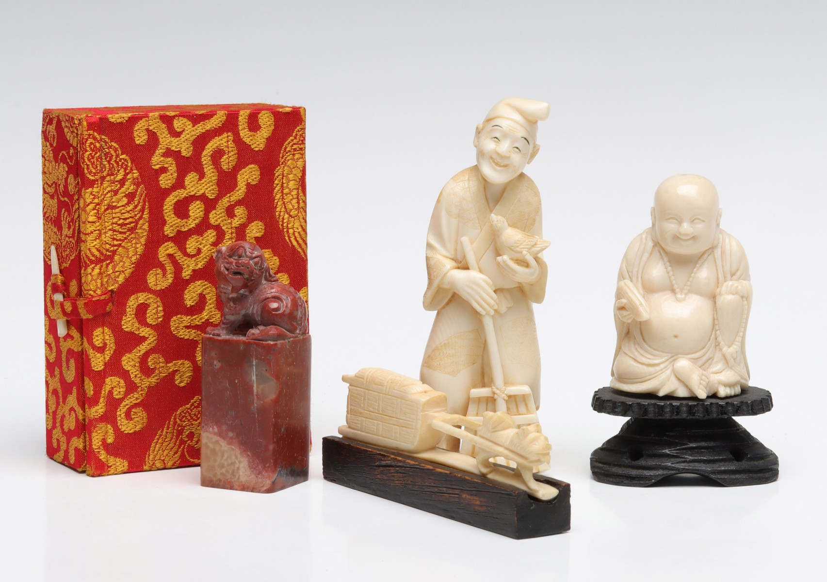 CARVED IVORY FIGURES AND SOAPSTONE SEAL IN BOX