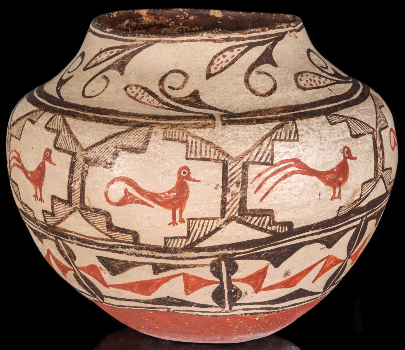 A 19TH CENTURY ZUNI PUEBLO POTTERY OLLA WITH RED BASE