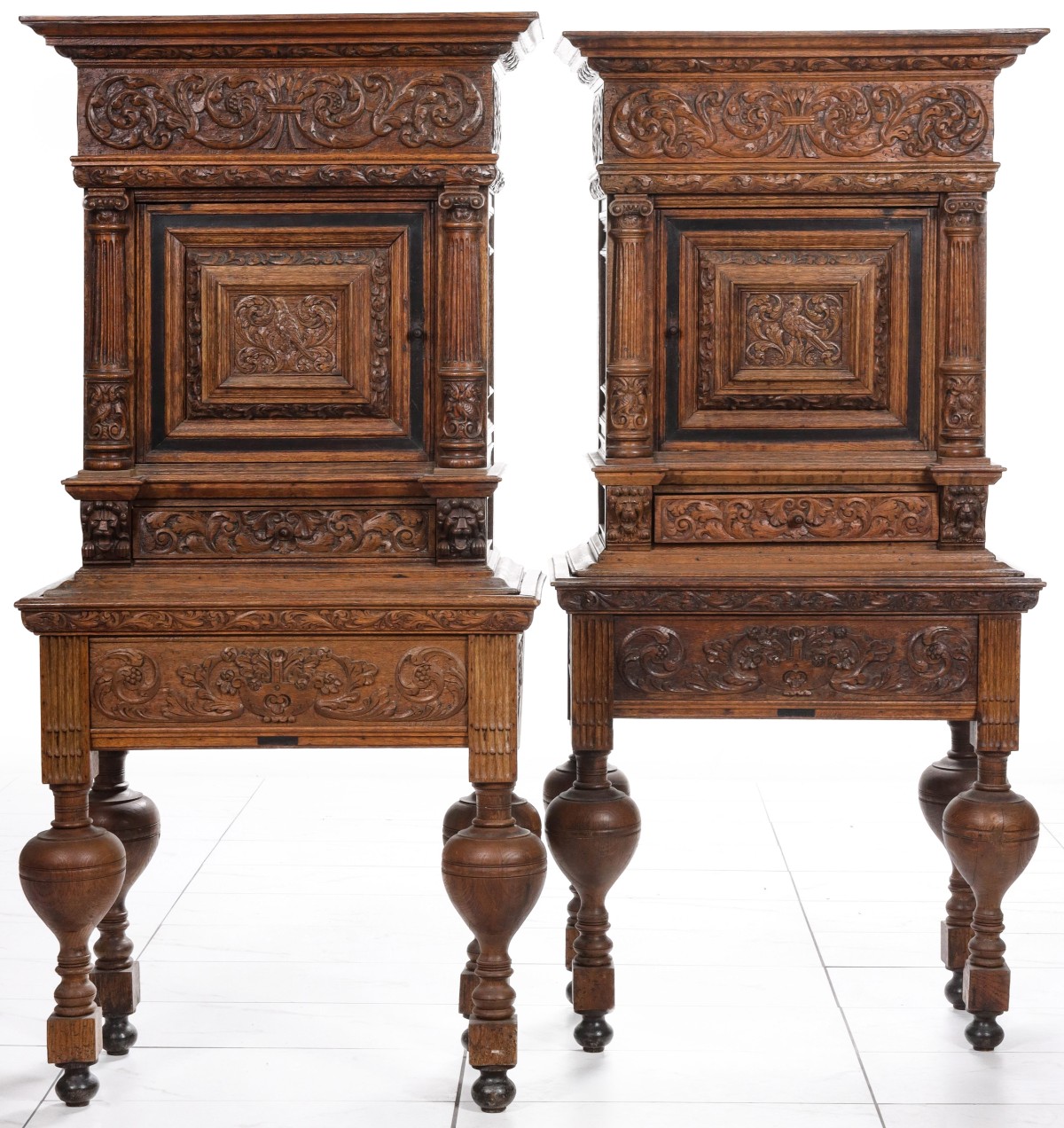 A PAIR 19TH C. RENAISSANCE REVIVAL CARVED OAK CABINETS