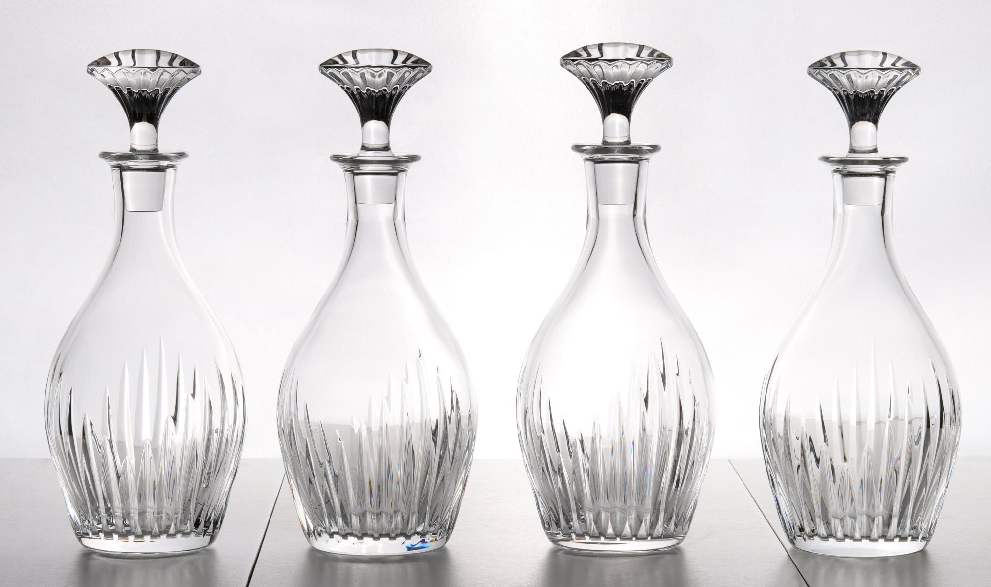 FOUR FRENCH CUT CRYSTAL DECANTERS SIGNED BACCARAT