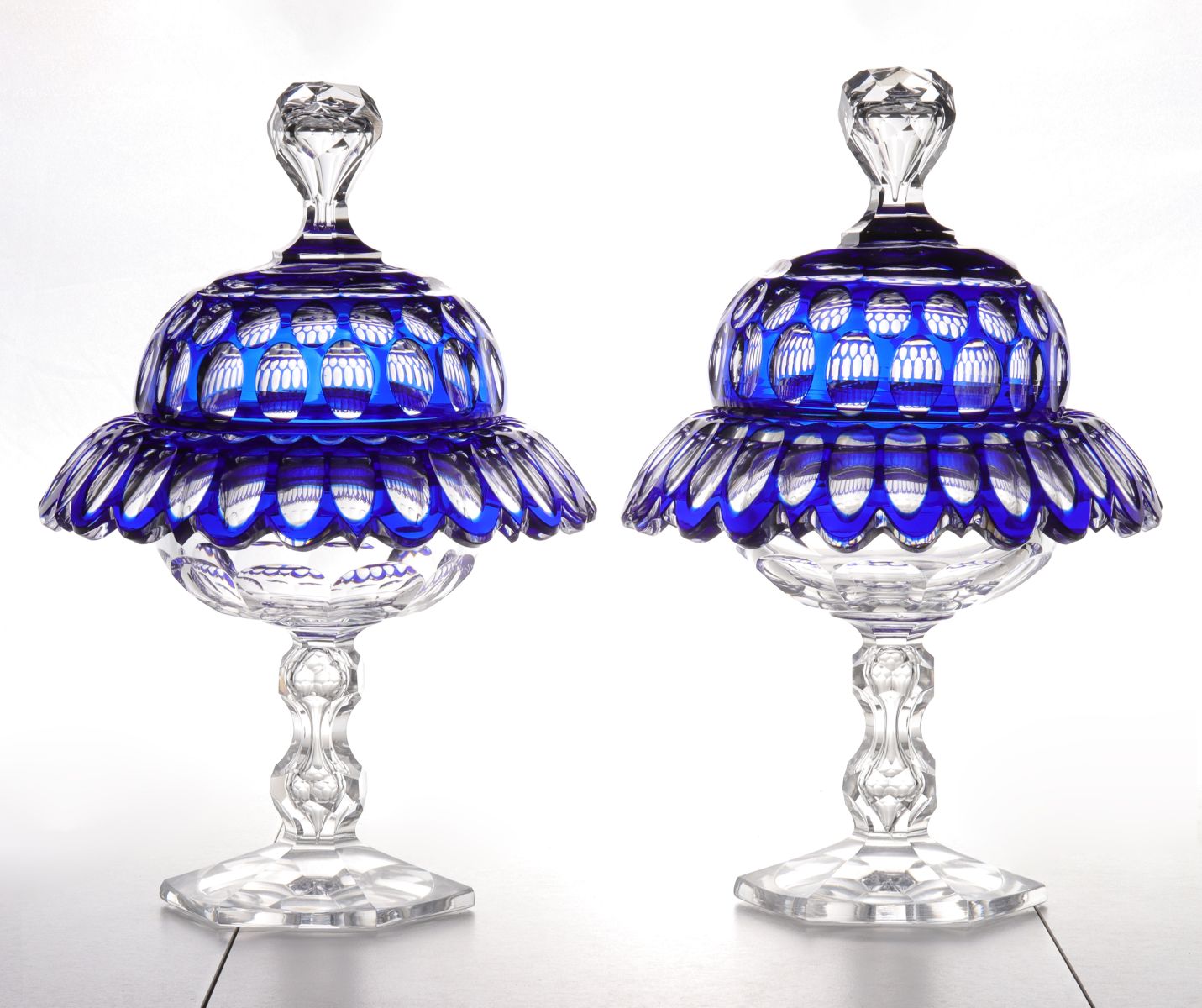 A FINE PAIR BLUE CUT TO CLEAR GLASS COVERED COMPOTES