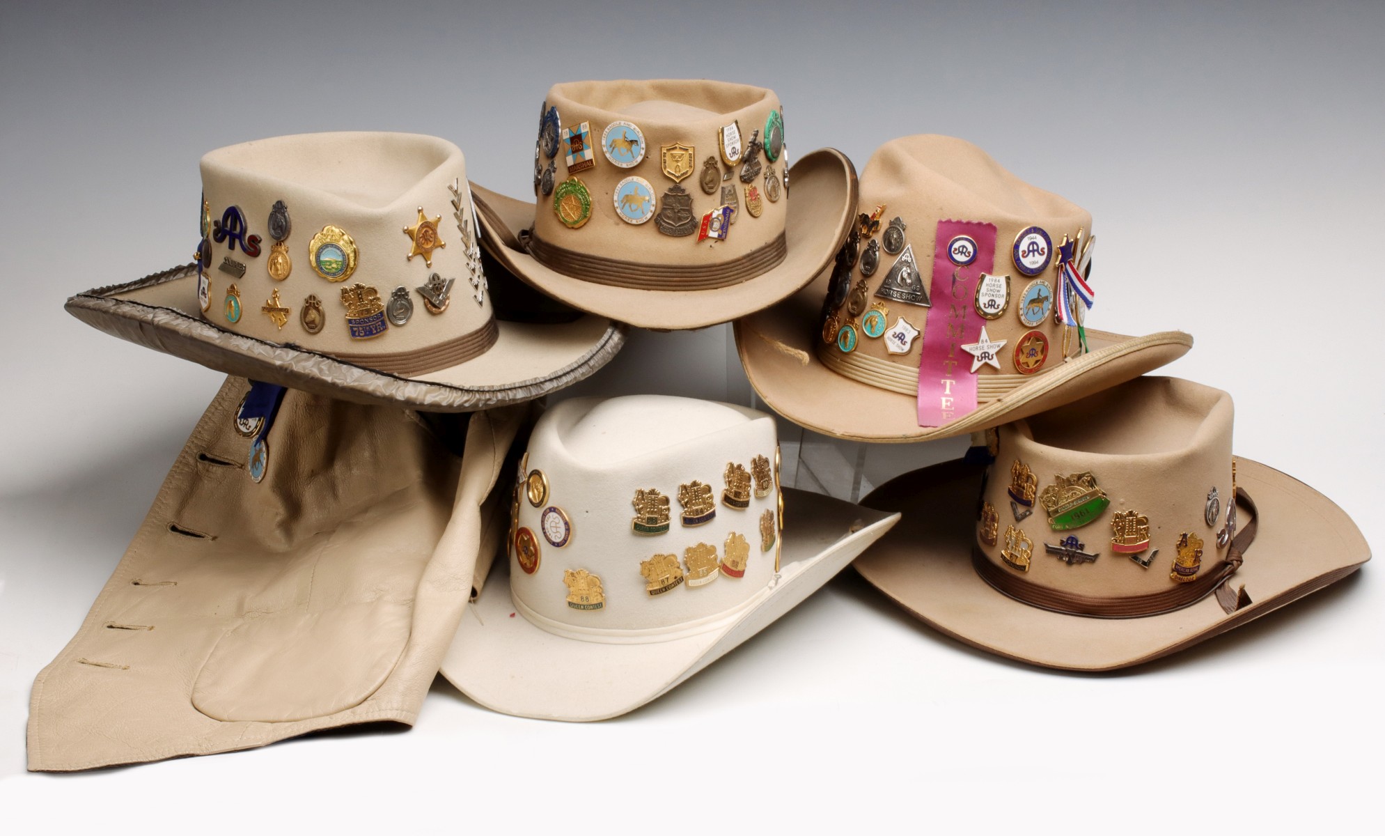 AMERICAN ROYAL AND OTHER PINS ON STETSON & OTHER HATS