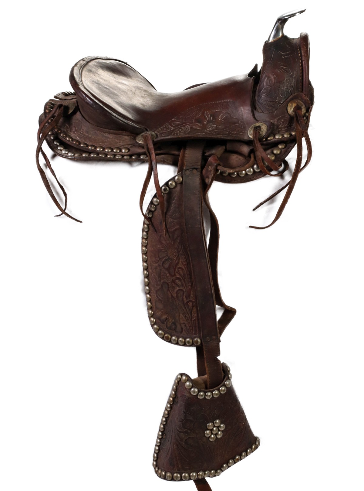 A 12-INCH CHILD'S SADDLE WITH TOOLING AND TAPADEROS