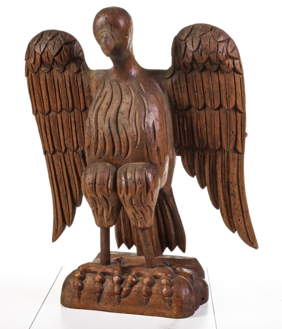 A FOLKY 19TH CENTURY CONTINENTAL CARVED EAGLE LECTERN