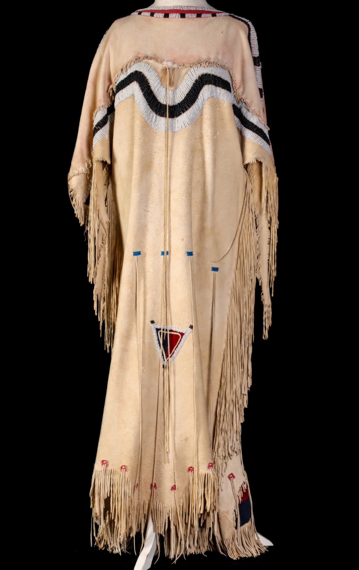 A 20TH CENTURY BLACKFOOT NATIVE AMERICAN BEADED DRESS