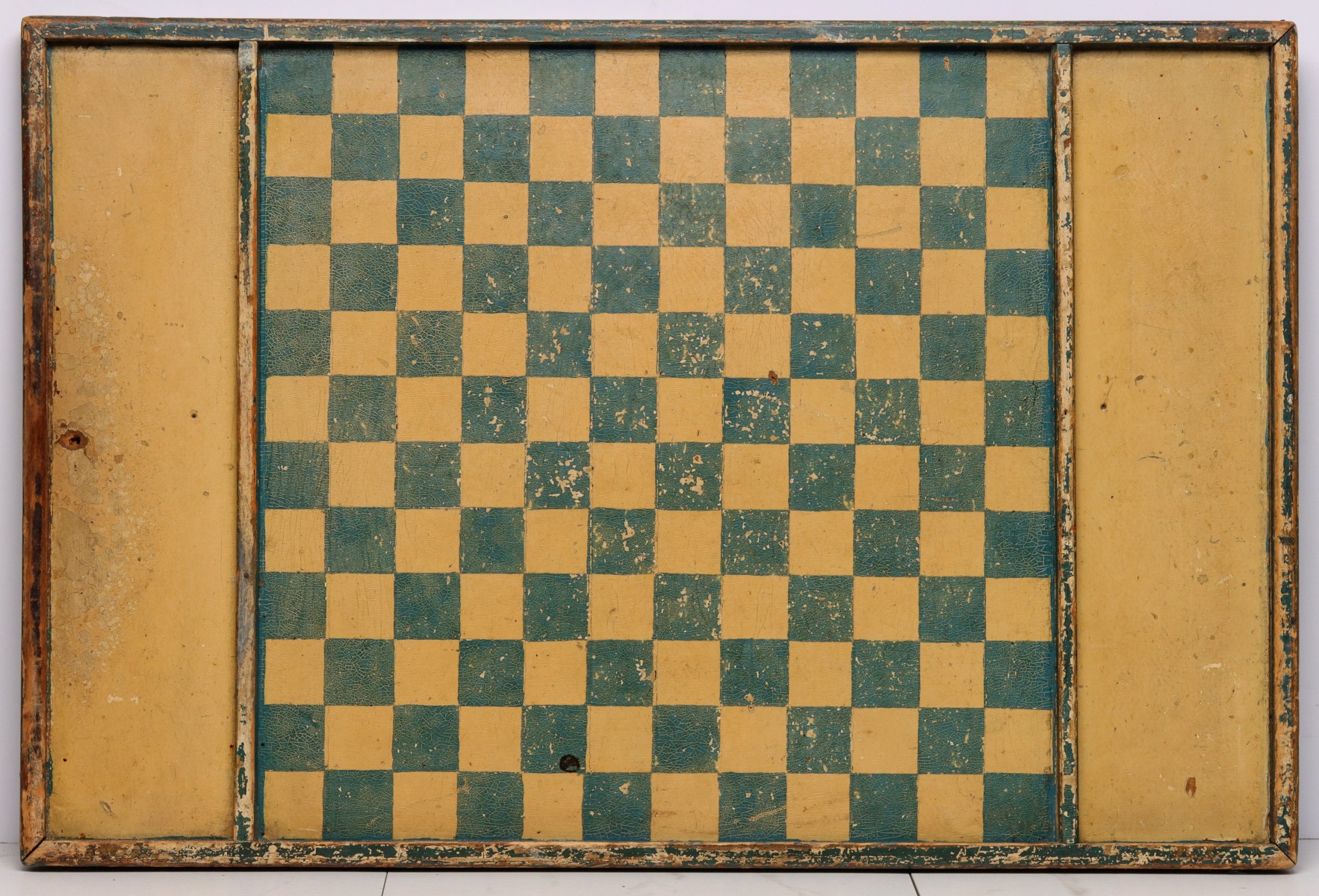 A 19C. AMERICAN GAME BOARD IN OLD MUSTARD AND GREEN