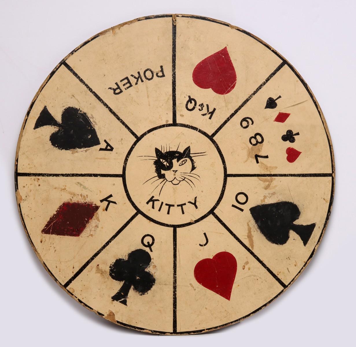 A CIRCA 1930s POKER RUMMY GAME WHEEL WITH CARD SUITS