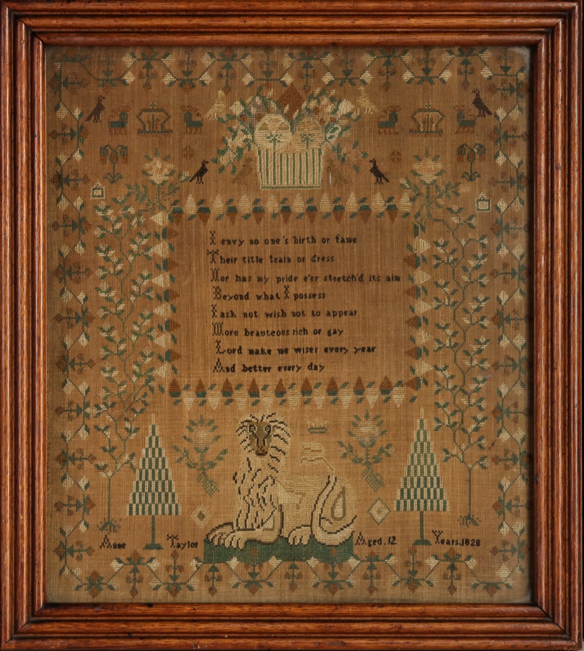 AN ELABORATE PICTORIAL CROSS STITCH SAMPLER DATED 1828