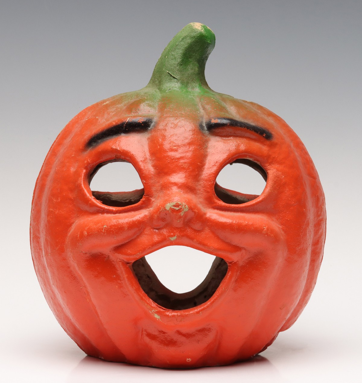 AN UNUSUALLY EXPRESSIVE PAPIER MACHE JACK-O-LANTERN