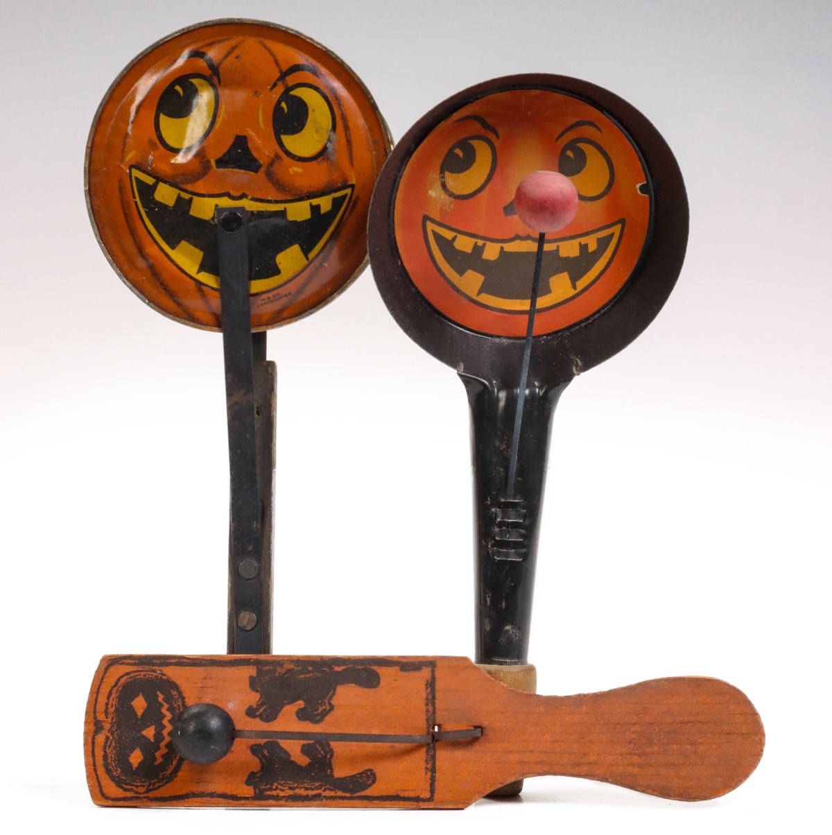 THREE ANTIQUE AND TIN LITHO HALLOWEEN NOISE MAKERS