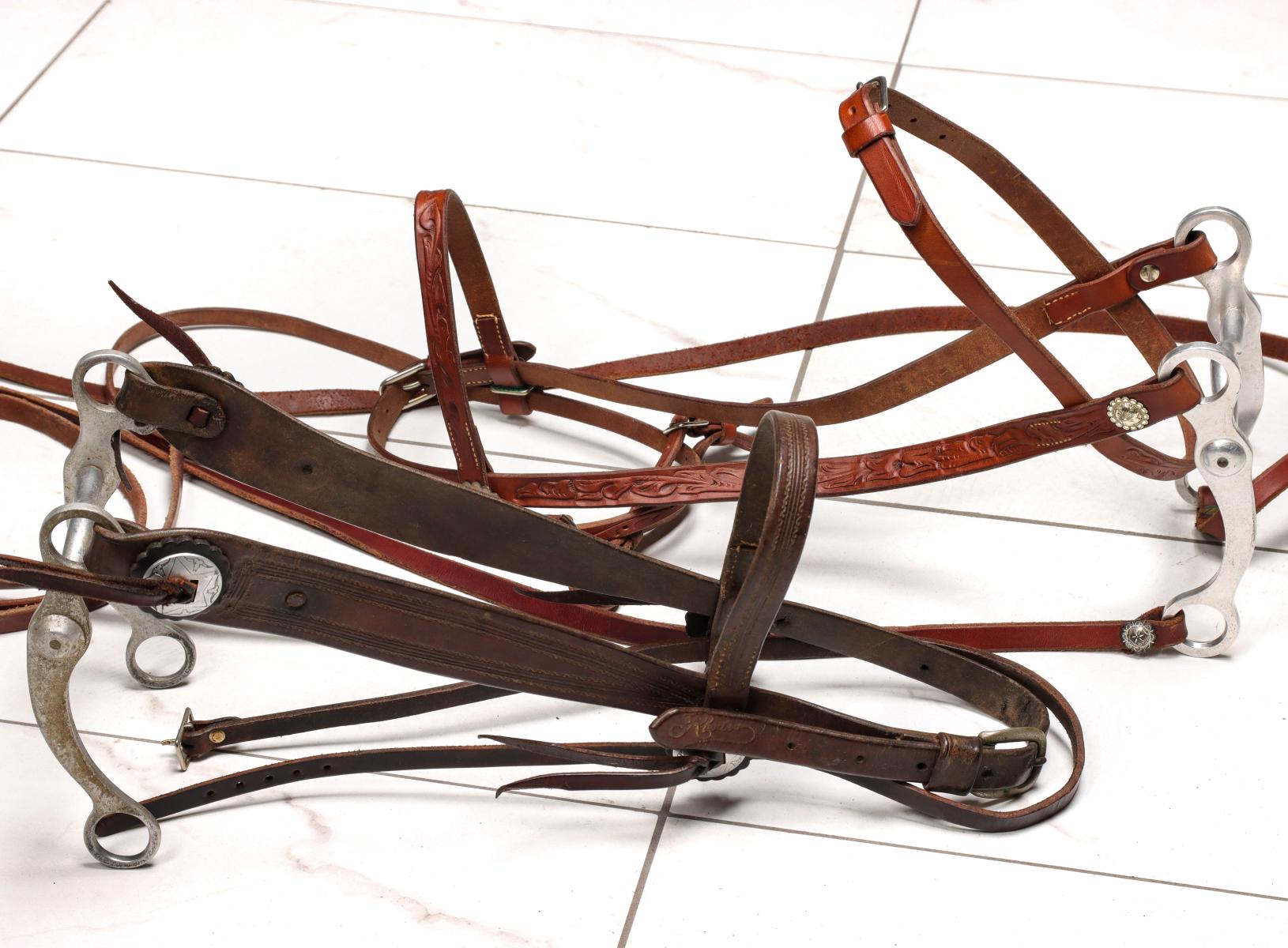 TWO HEADSTALLS STAMPED RHODES KC, ONE WITH CROCKETT BIT