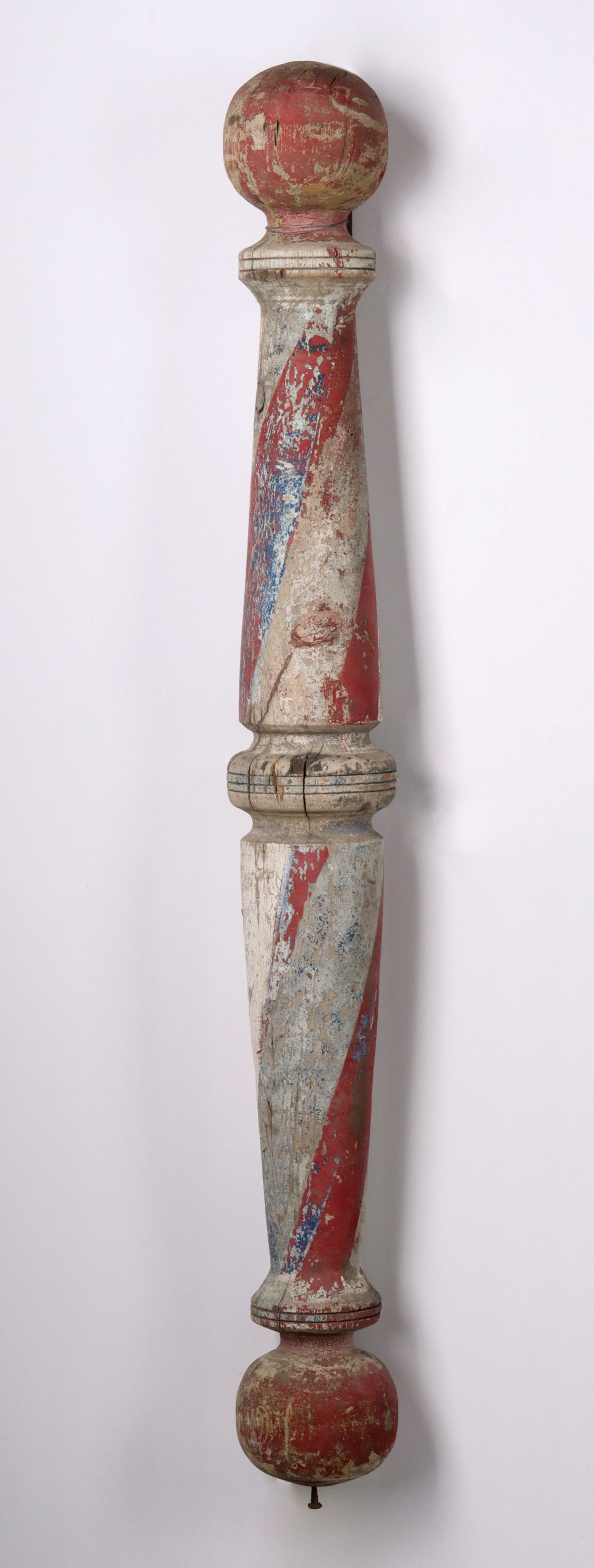 A 19TH CENT 45-INCH CARVED AND PAINTED WOOD BARBER POLE