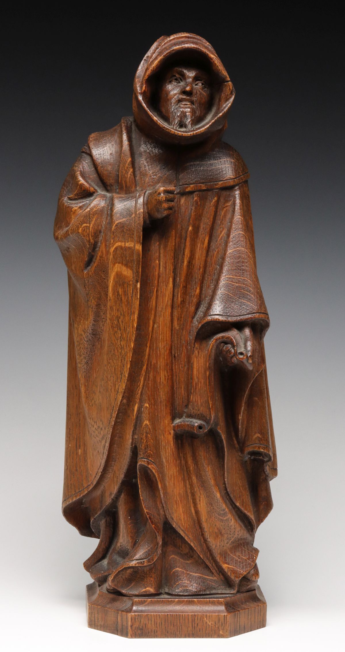 A 19TH CENTURY FRENCH CARVED OAK MONK IN ROBES