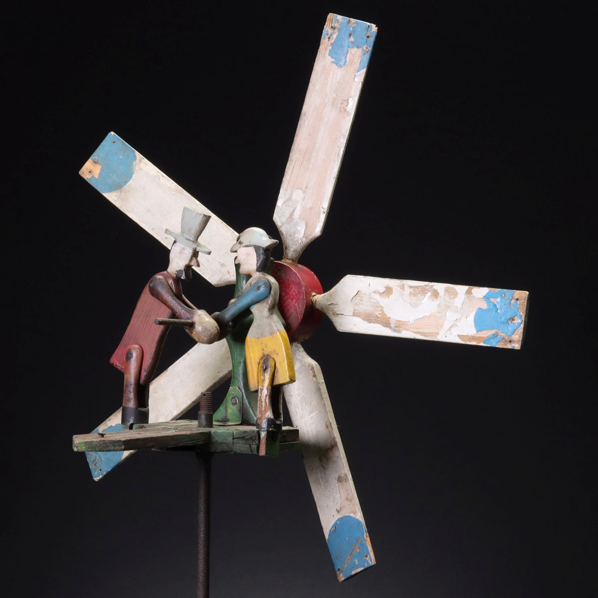 A COLORFUL CARVED AND PAINTED FOLK ART WHIRLIGIG